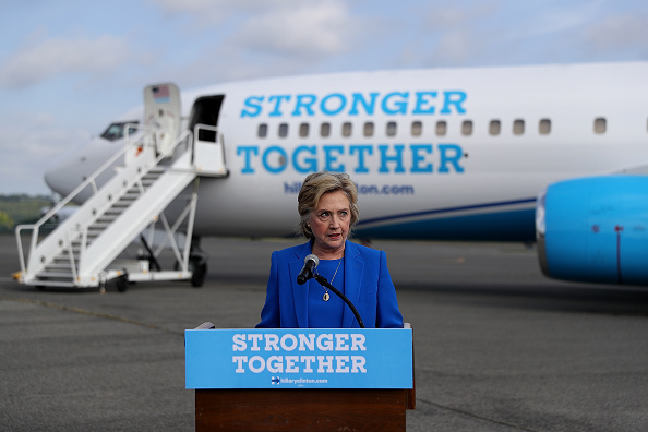 Democratic presidential nominee former Secretary of State Hillary Clinton speaks to reporters on the tarmac at Westchester County Airport on September 8, 2016 in White Plains, New York.