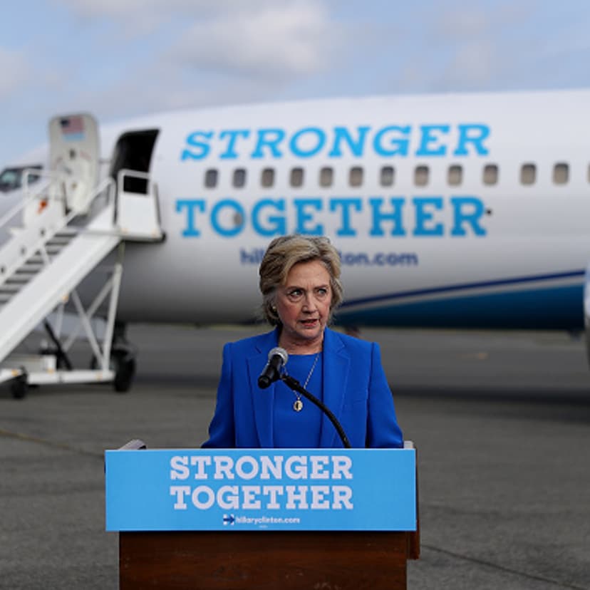 Democratic presidential nominee former Secretary of State Hillary Clinton speaks to reporters on the tarmac at Westchester County Airport on September 8, 2016 in White Plains, New York.