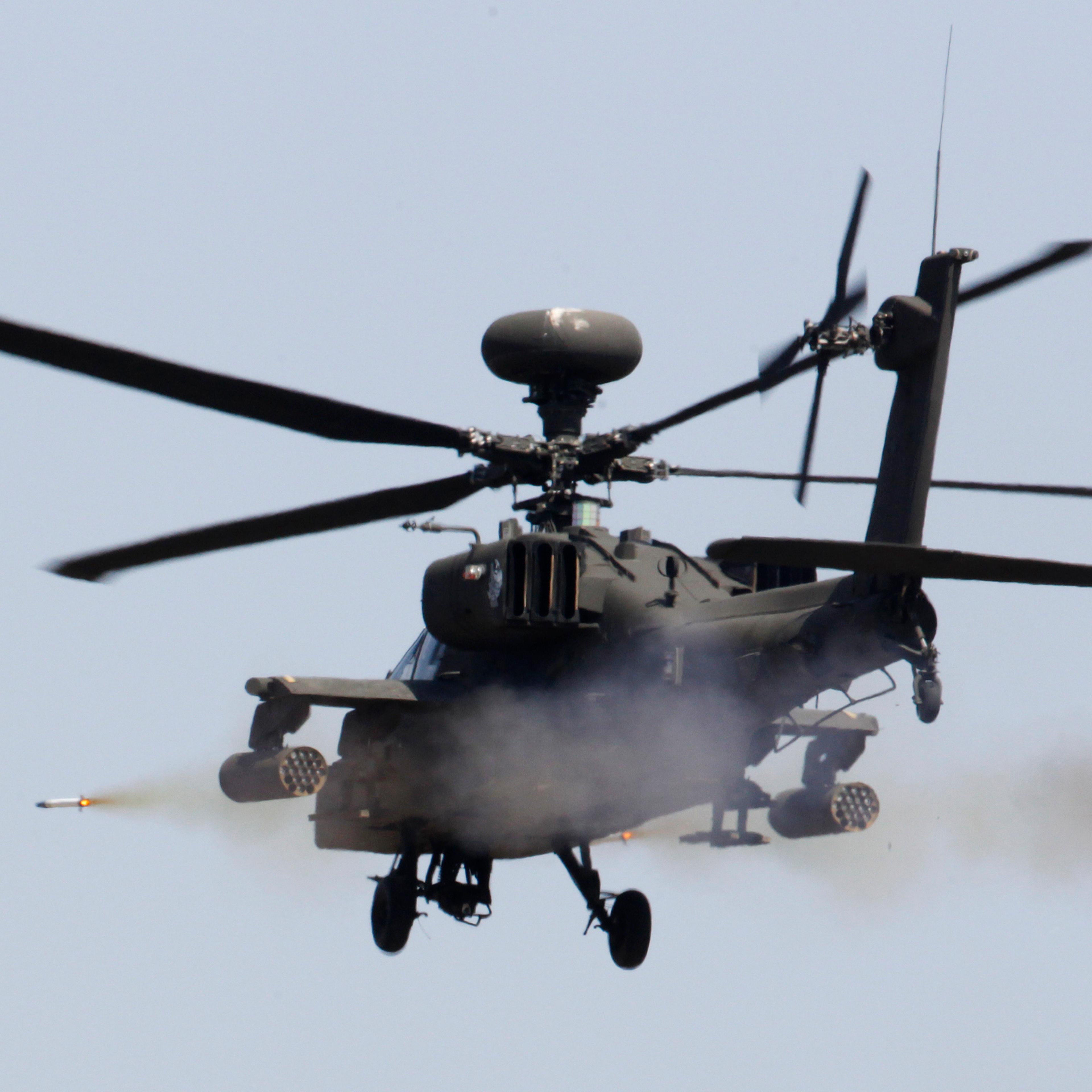 A U.S. AH-64 Apache helicopter fires a missile during a live fire gunnery exercise with the South Korean army at the U.S. army's Rodriguez range in Pocheon