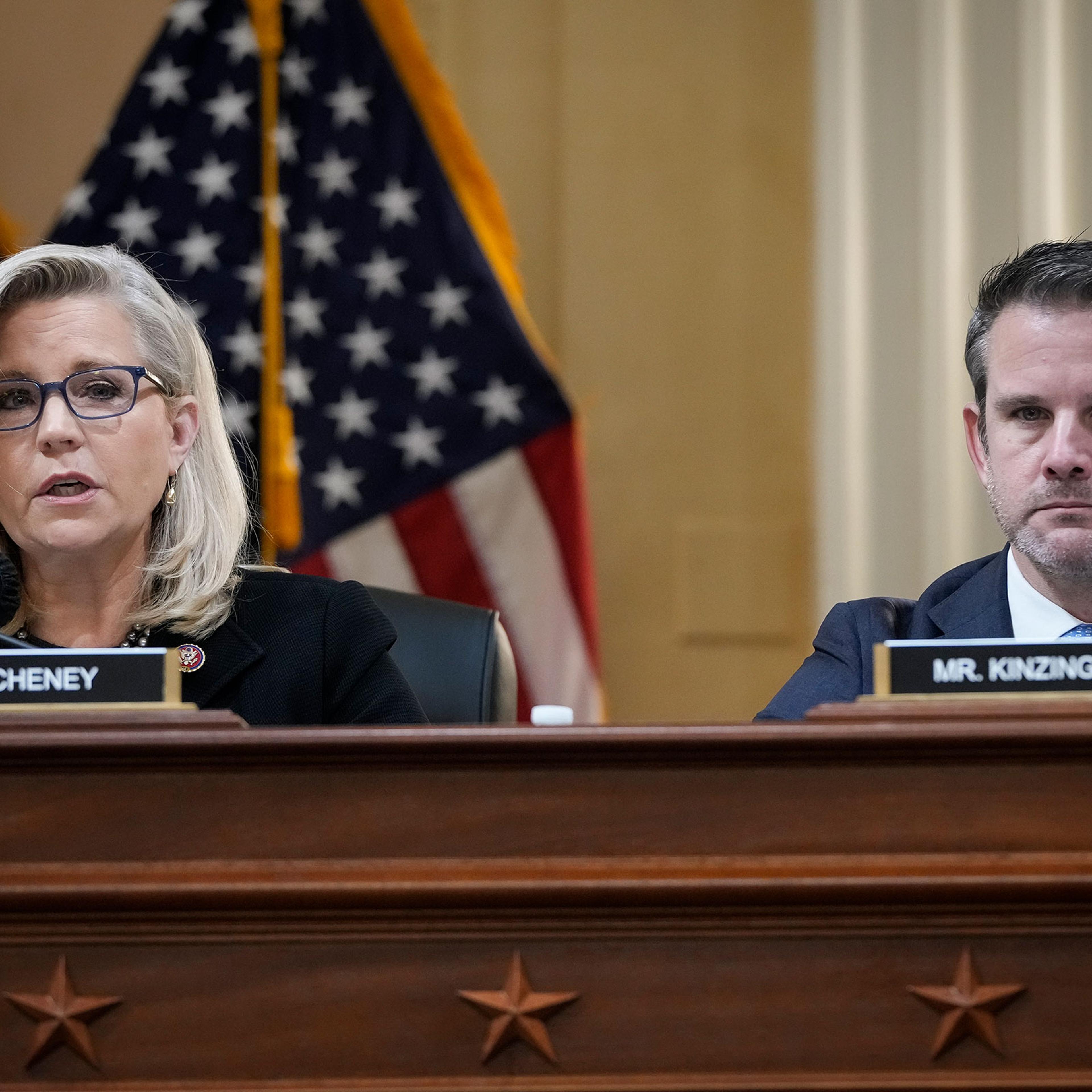 Rep. Liz Cheney and Rep. Adam Kinzinger listen during a committee meeting on Capitol Hill in Washington on Dec. 1, 2021.