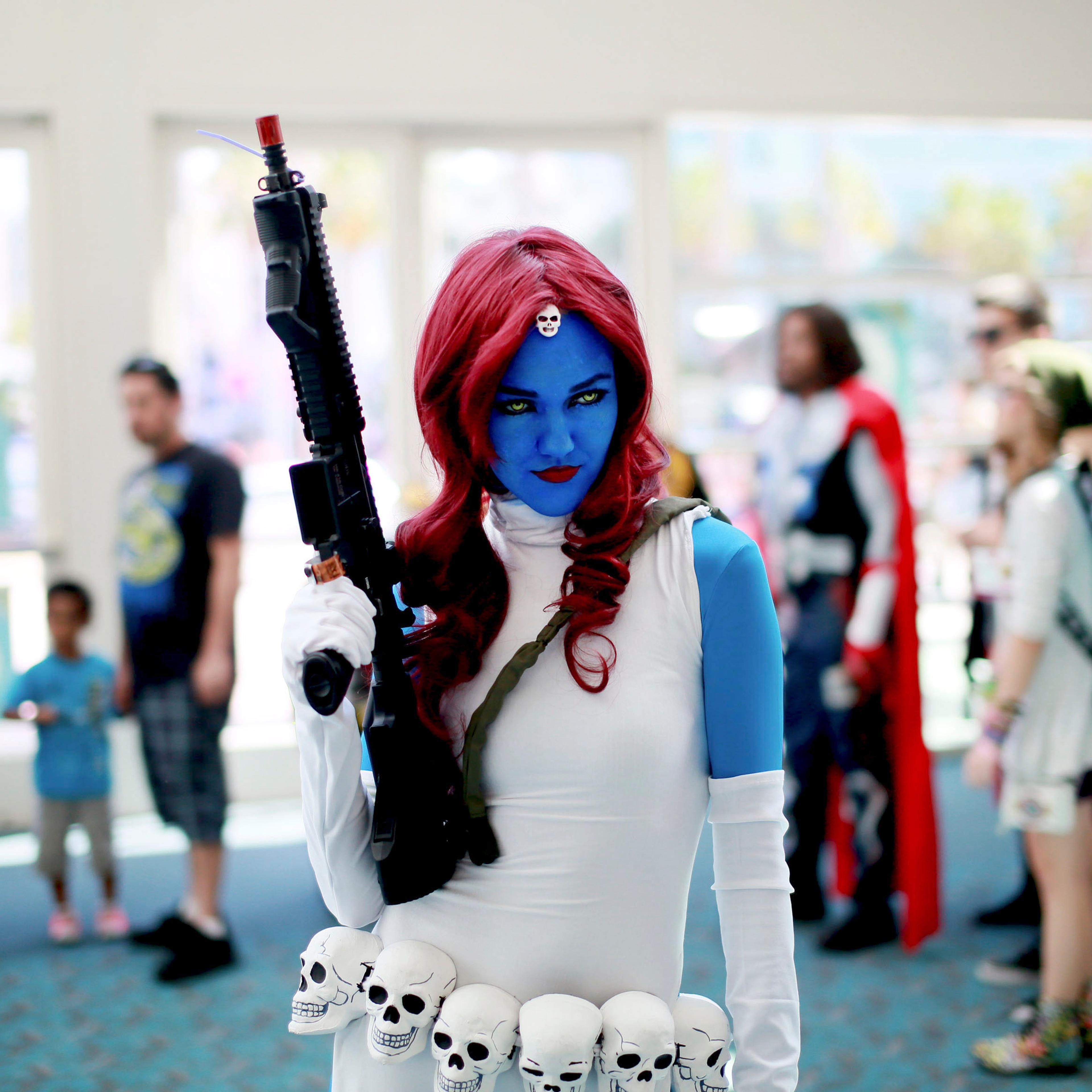 Allie Shaughnessy, who is dressed as Mystique, poses during the 2014 Comic-Con International Convention in San Diego, California