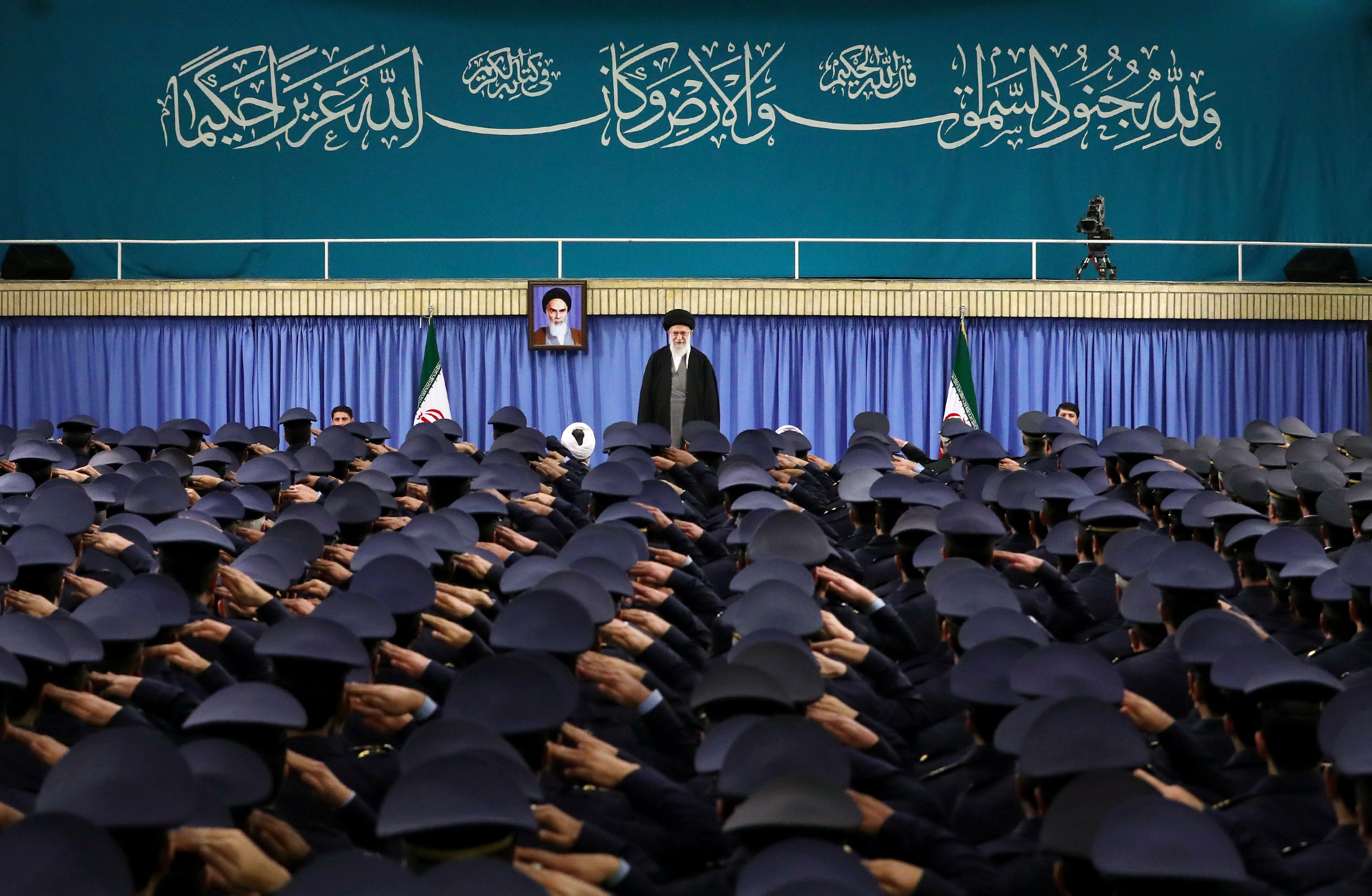 Supreme Leader Ayatollah Ali Khamenei stands as air force commanders salute during their meeting in Tehran, Iran, Tuesday, Feb. 7, 2017.