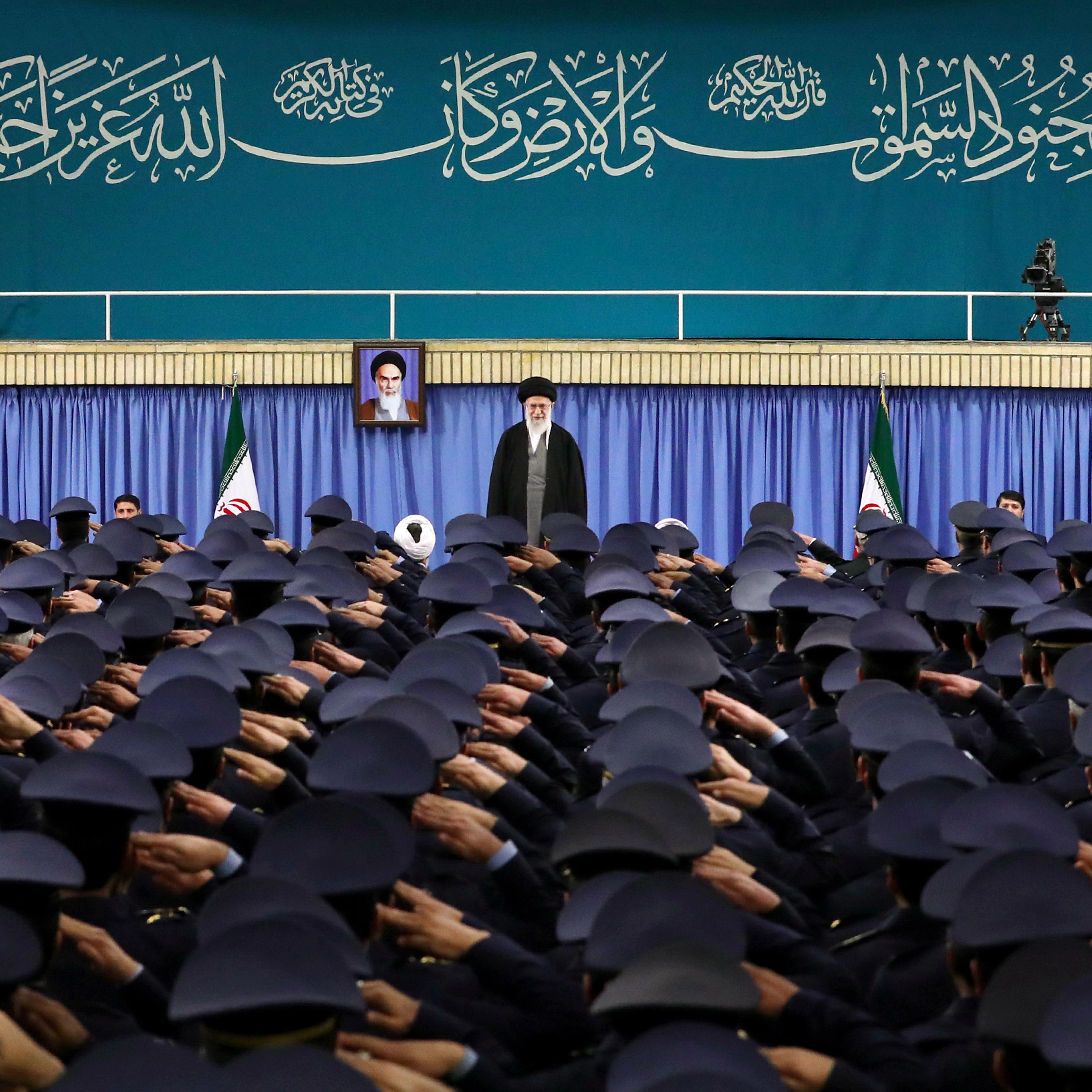 Supreme Leader Ayatollah Ali Khamenei stands as air force commanders salute during their meeting in Tehran, Iran, Tuesday, Feb. 7, 2017.