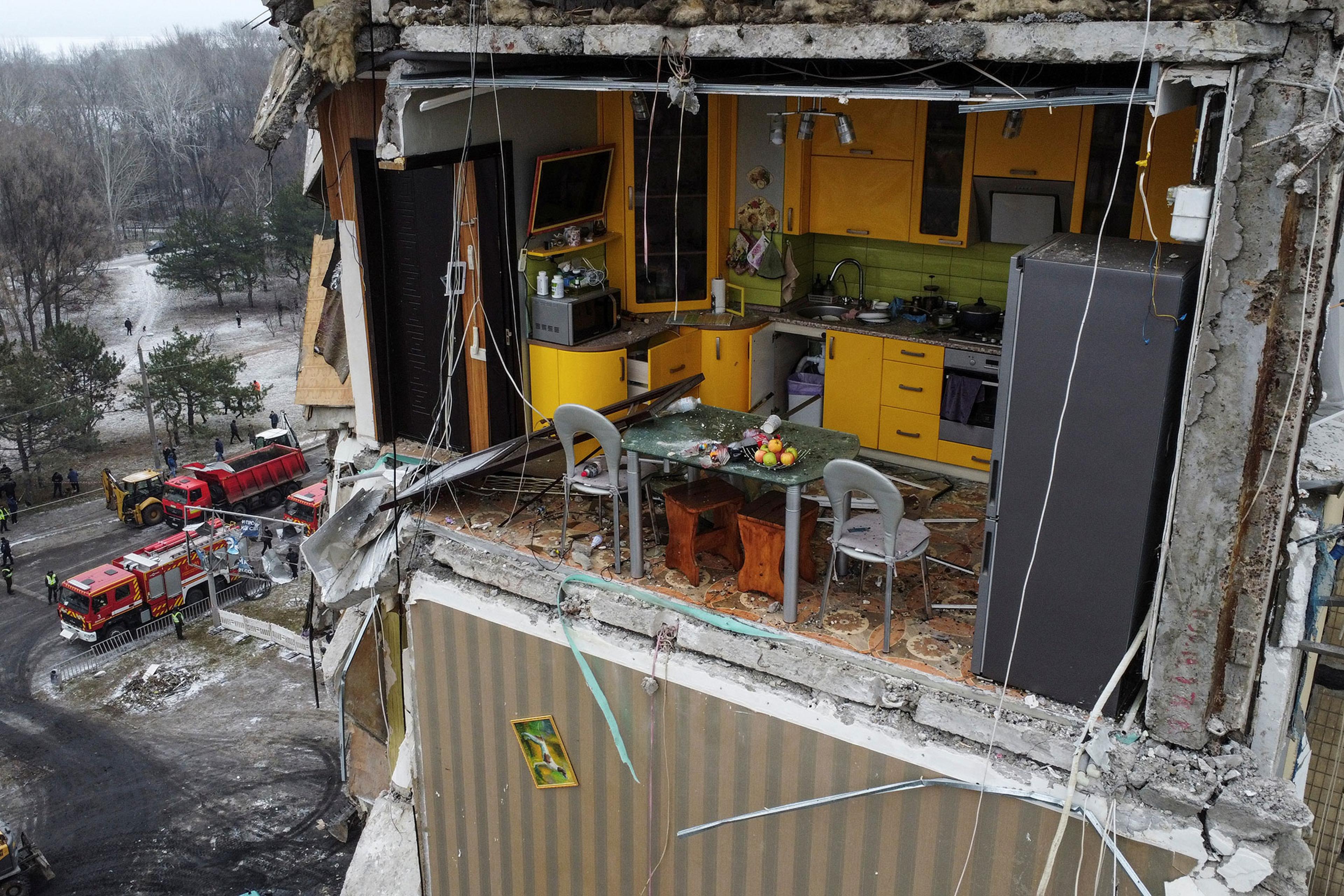Aftermath of Dnipro apartment block destruction following missile strike