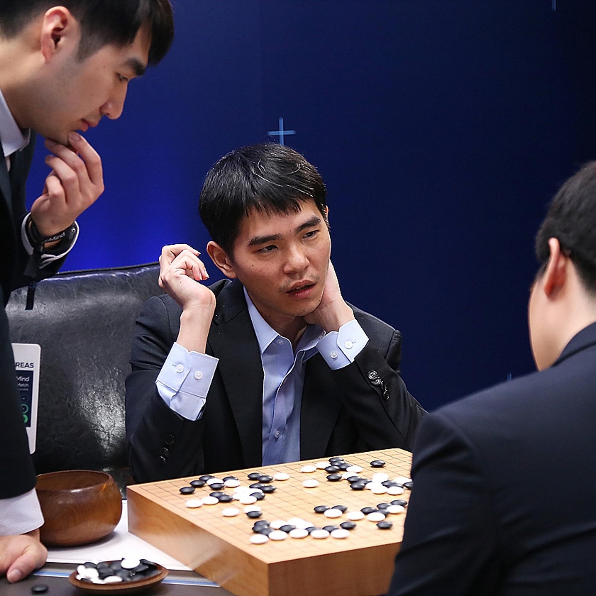In this handout image provided by Google, South Korean professional Go player Lee Se-Dol reviews the match with other professional Go players after the fourth match against Google's artificial intelligence program, AlphaGo, during the Google DeepMind Cha