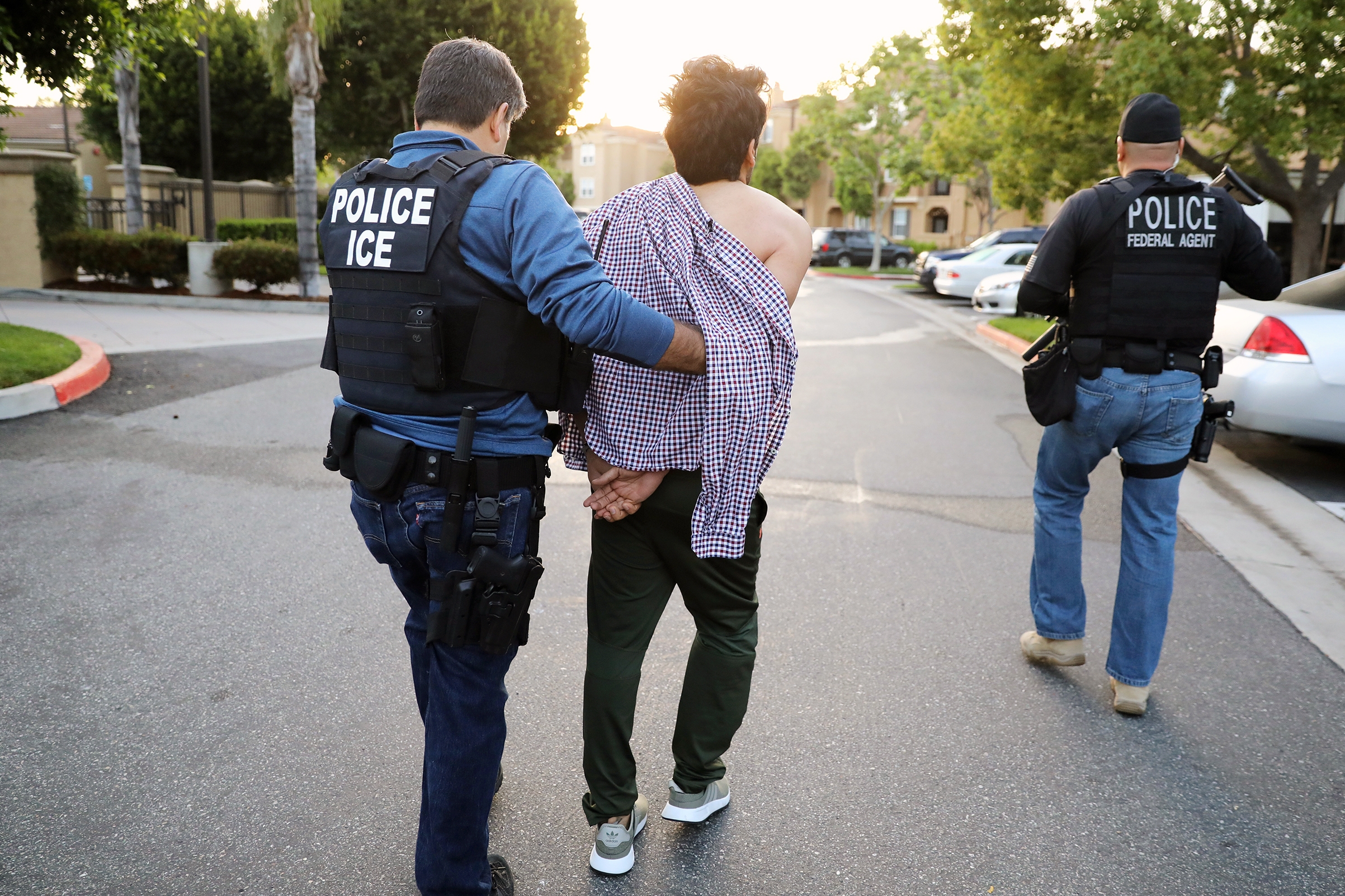 An Iranian immigrant is led away in California in May