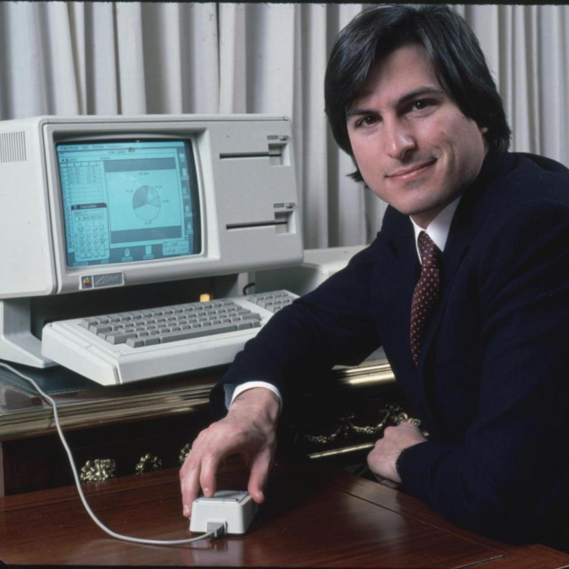 Steve Jobs poses with the Lisa computer during a 1983 press preview.