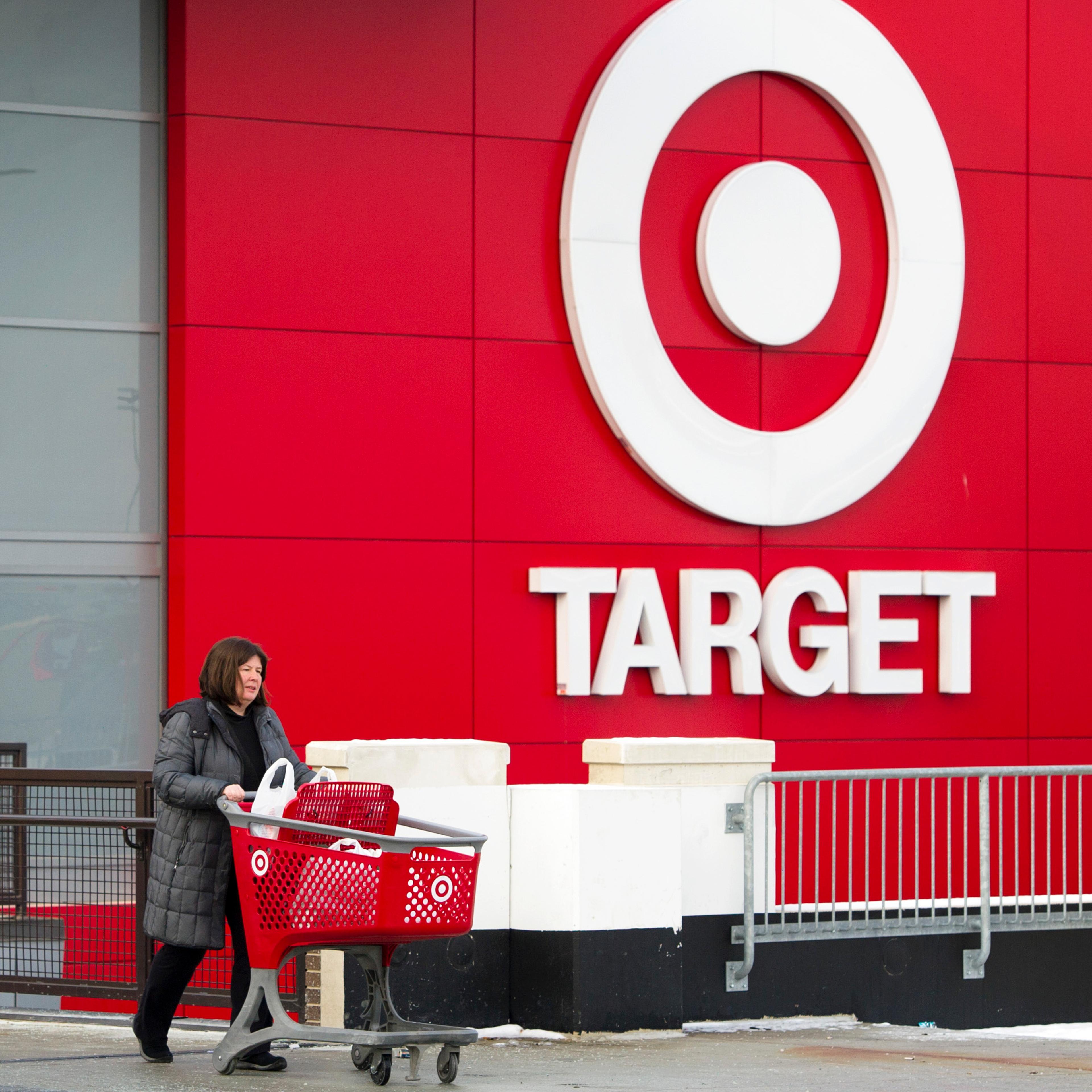 Shopper Laura Steele leaves a Target store in Toronto, Ontario, Thursday, January 15, 2015. Target announced that they will be ceasing operations in Canada affecting about 18,000 jobs. (Photo by Kevin Van Paassen Bloomberg)