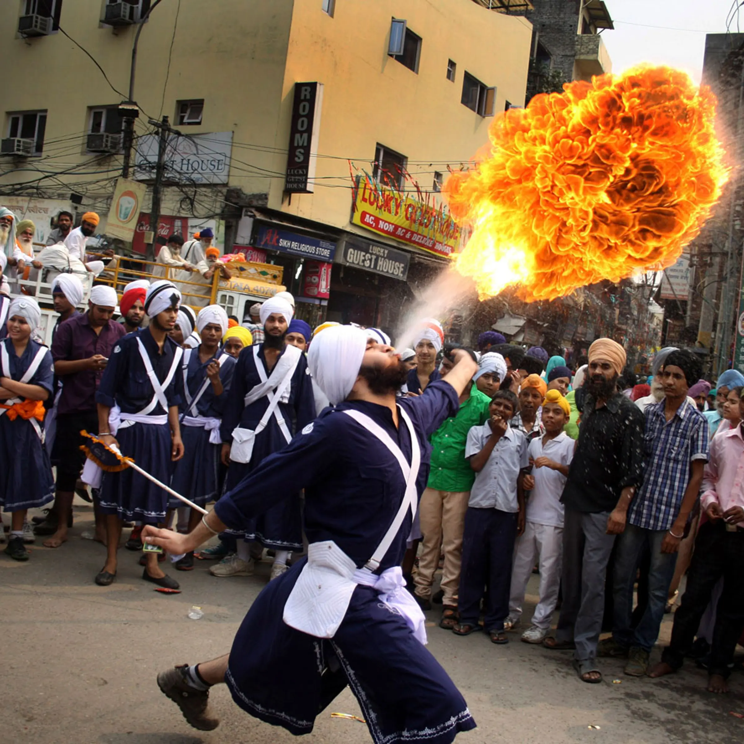 Oct. 8, 2013. A Sikh youth breathes fire during a religious procession on the eve of Guru Ram Das's birthday in Amritsar, India.