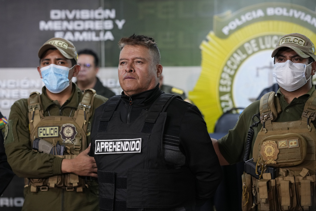 Bolivian police hold the detained Juan Jose Zuniga, former general commander of the Army, in La Paz, Bolivia, Wednesday, June 26, 2024.