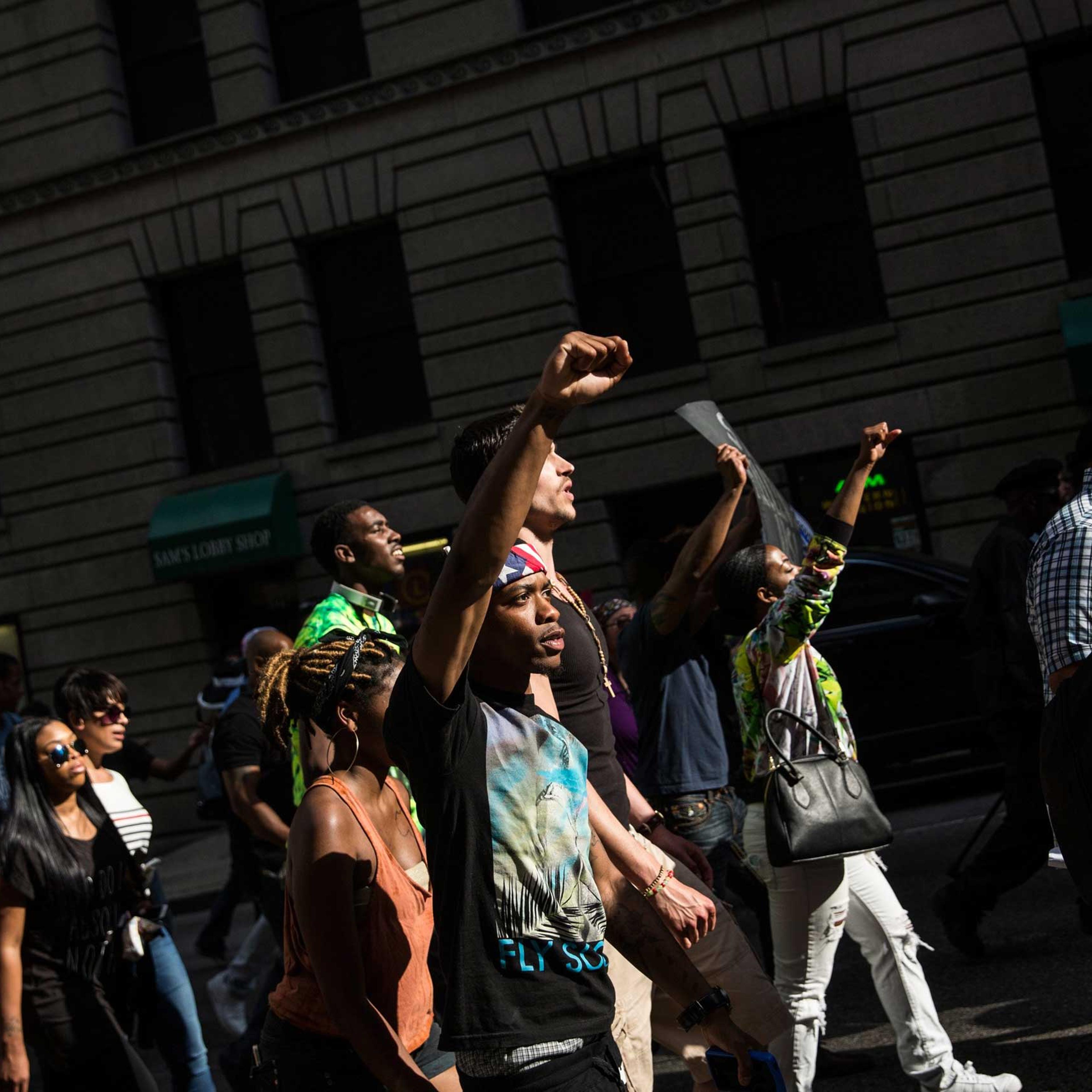 Protesters march from City hall to the Sandtown neighborhood in Baltimore on May 2, 2015.