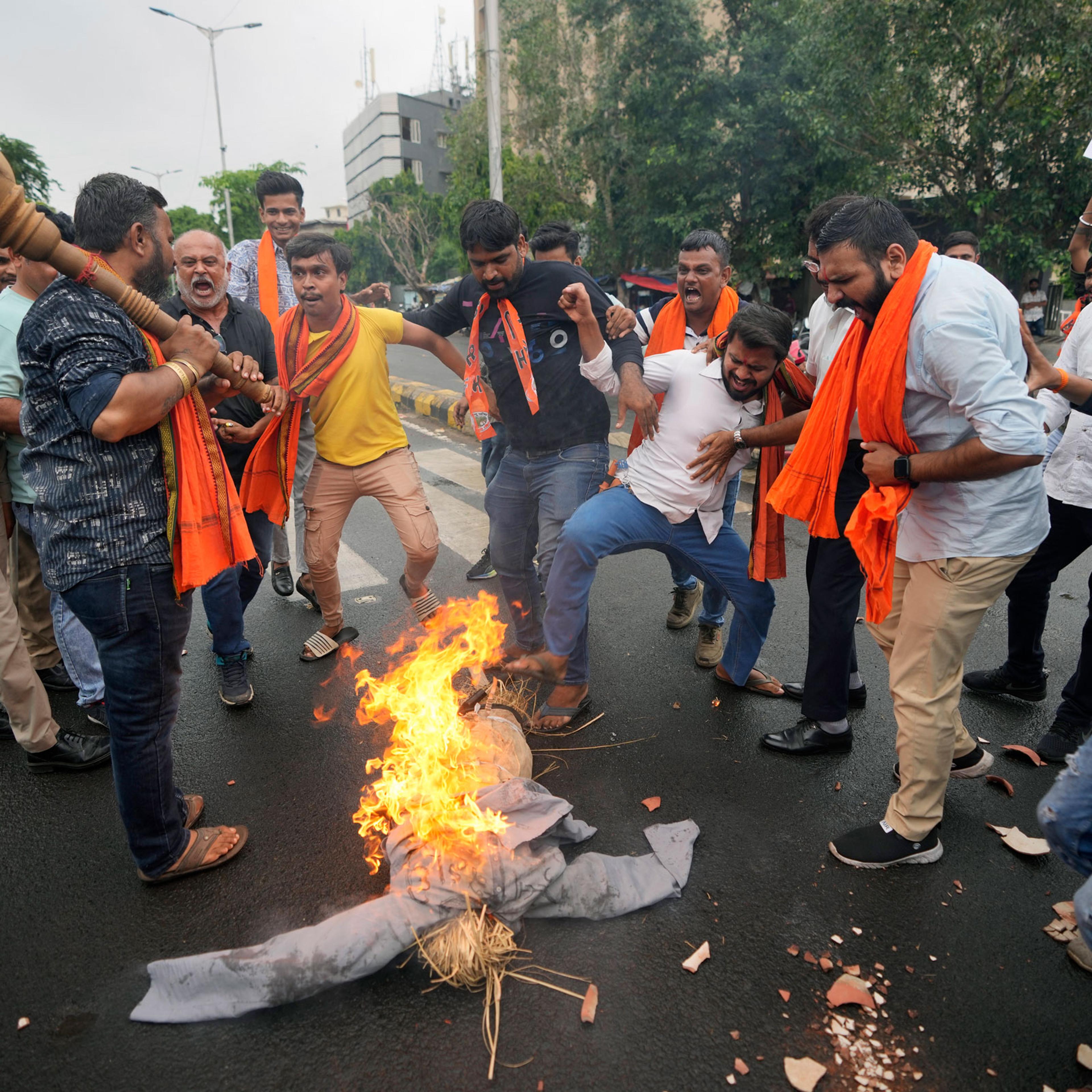 right-wing Hindu groups burn an effigy and shout slogans in Ahmedabad, India