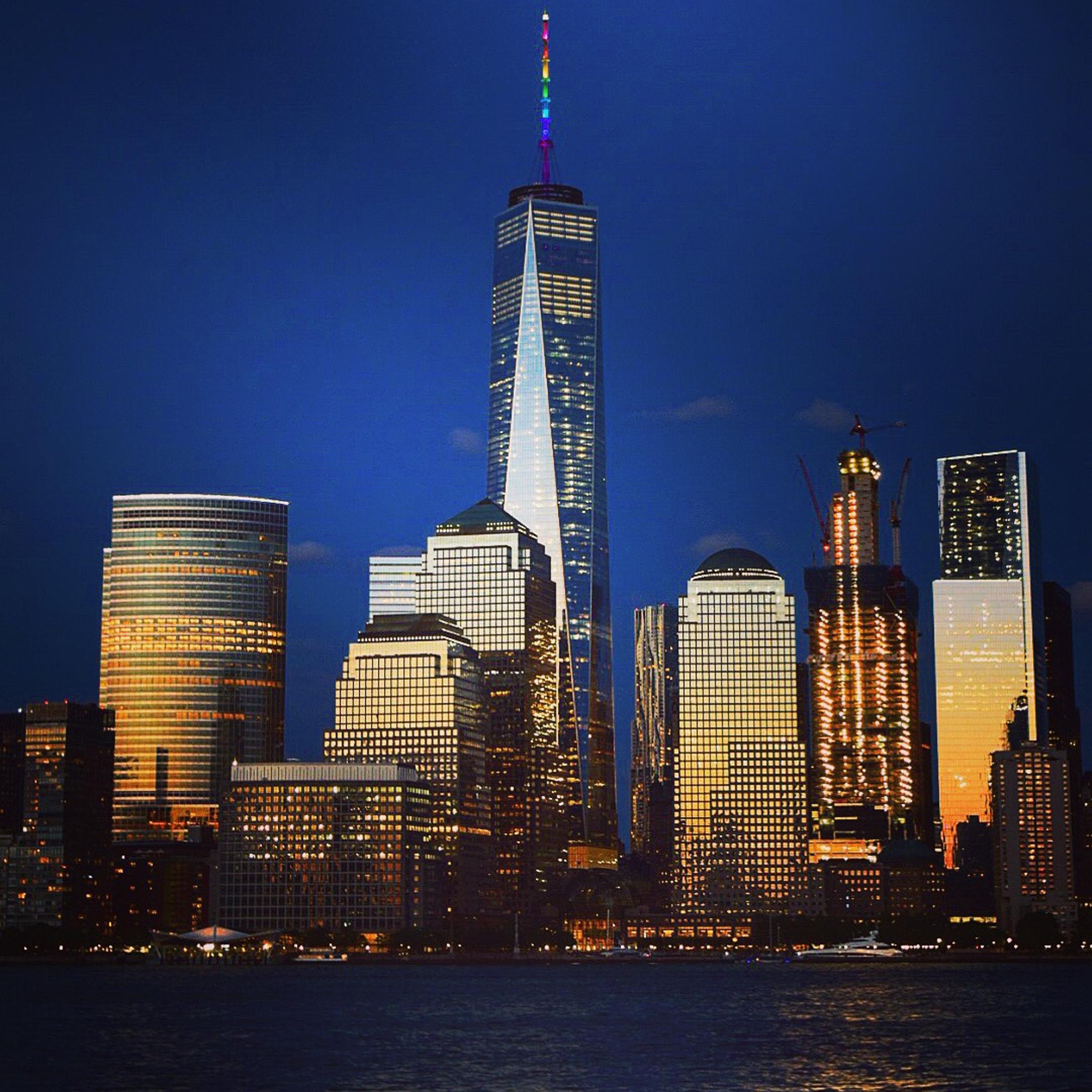 The spire of One World Trade Center lights up in the colors of the rainbow on June 12, 2016 to remember victims of the mass shooting at a gay nightclub in Orlando.