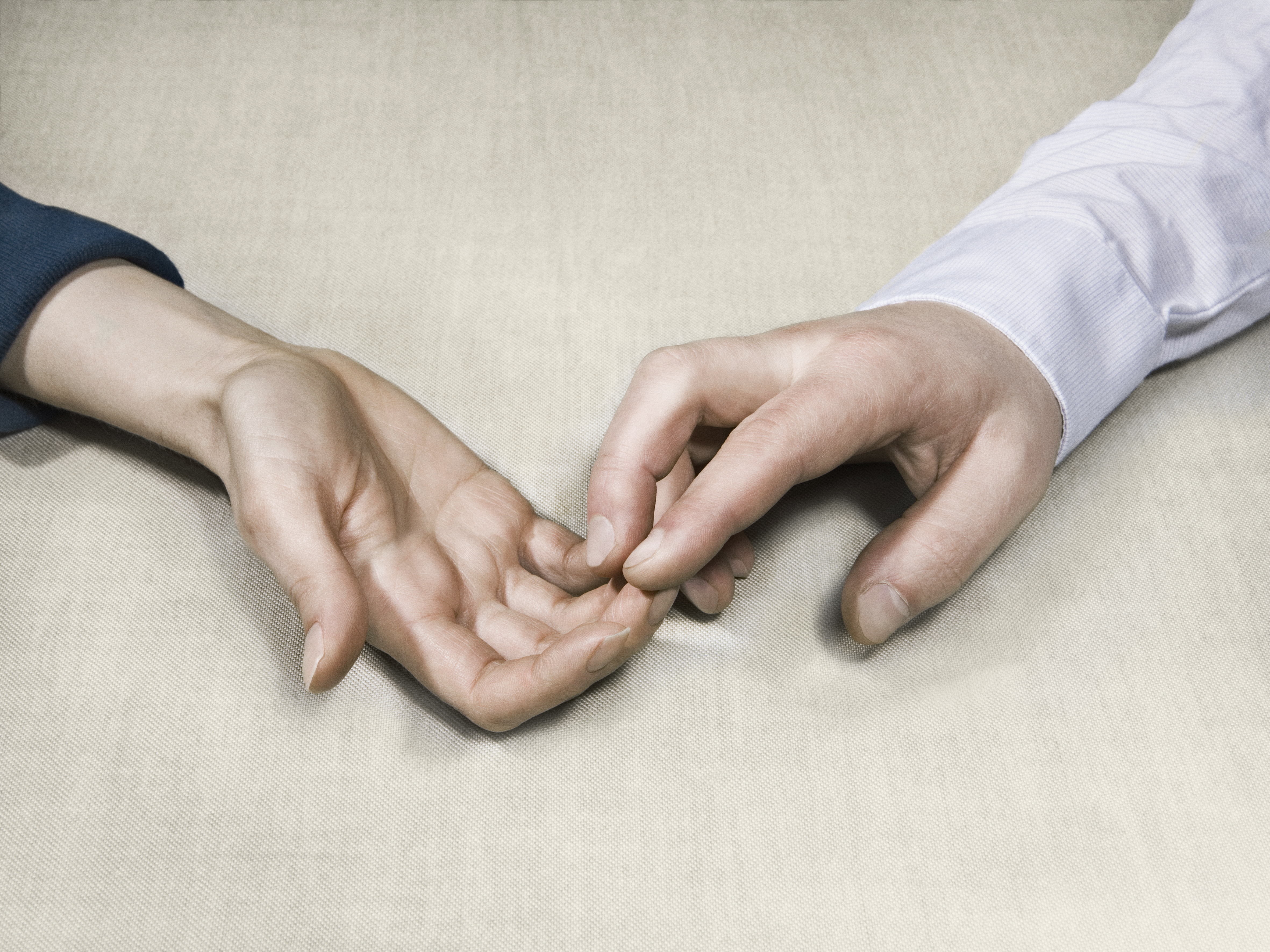 two men touching each others hands