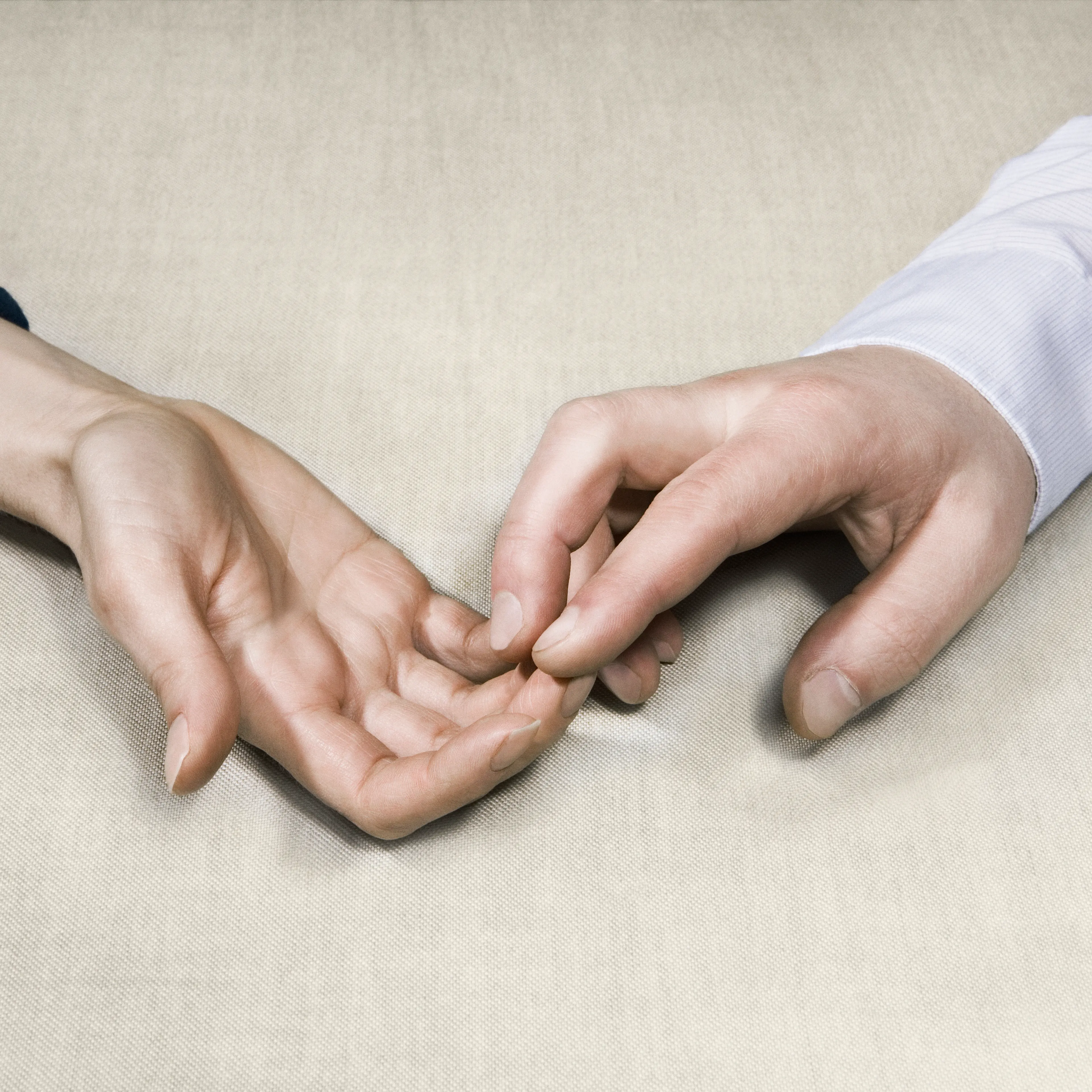 two men touching each others hands