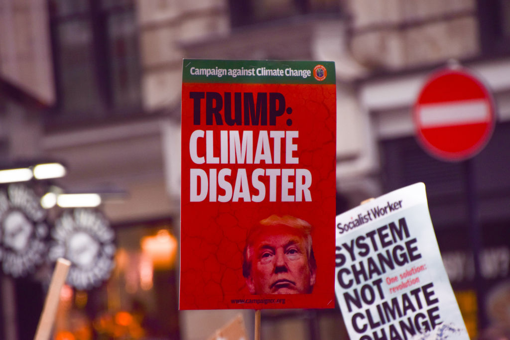 A protester holds a placard describing the election of