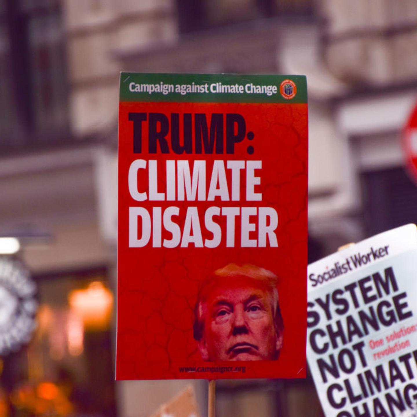 A protester holds a placard describing the election of
