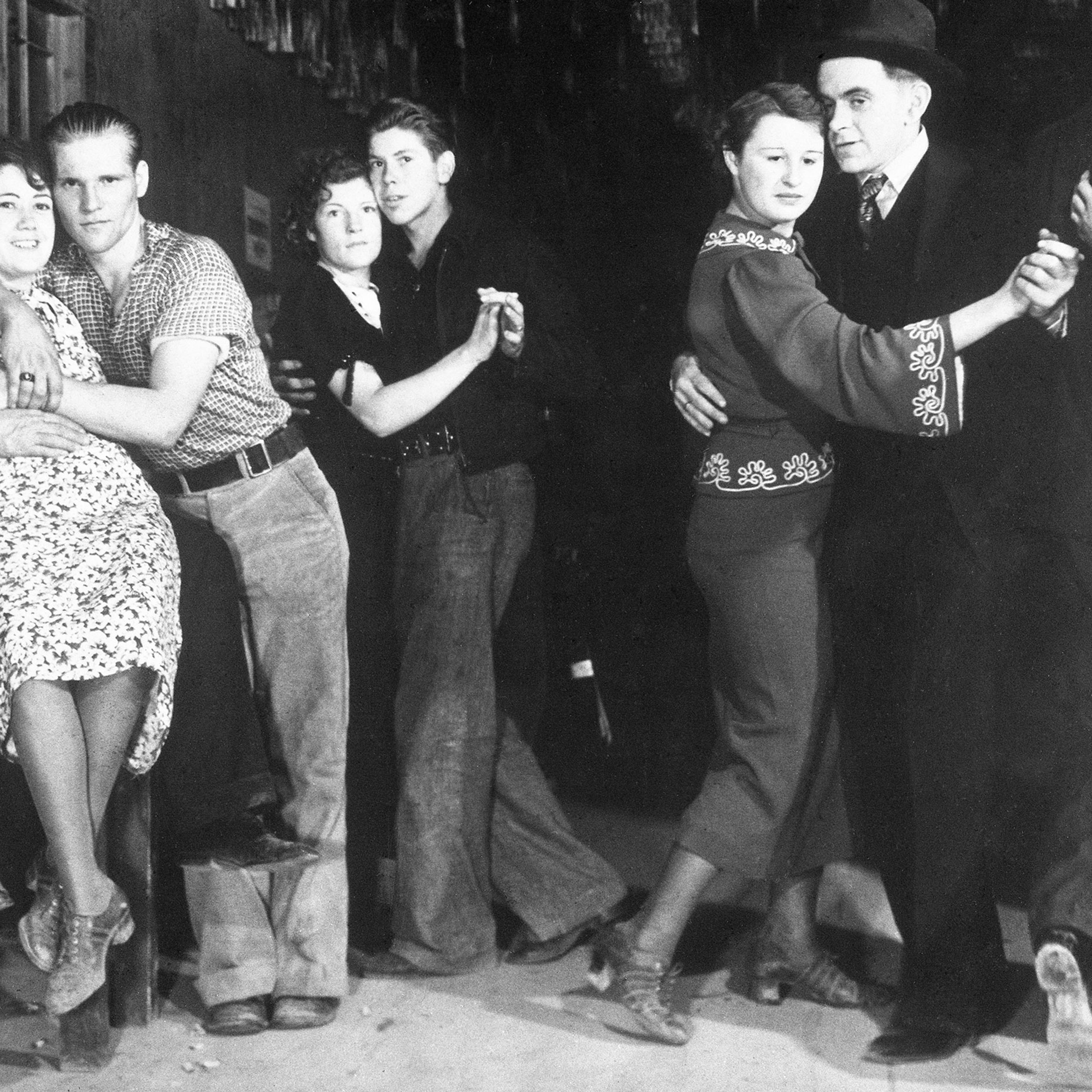 Workers on Montana's Fort Peck Dam blow off steam at night, 1936.