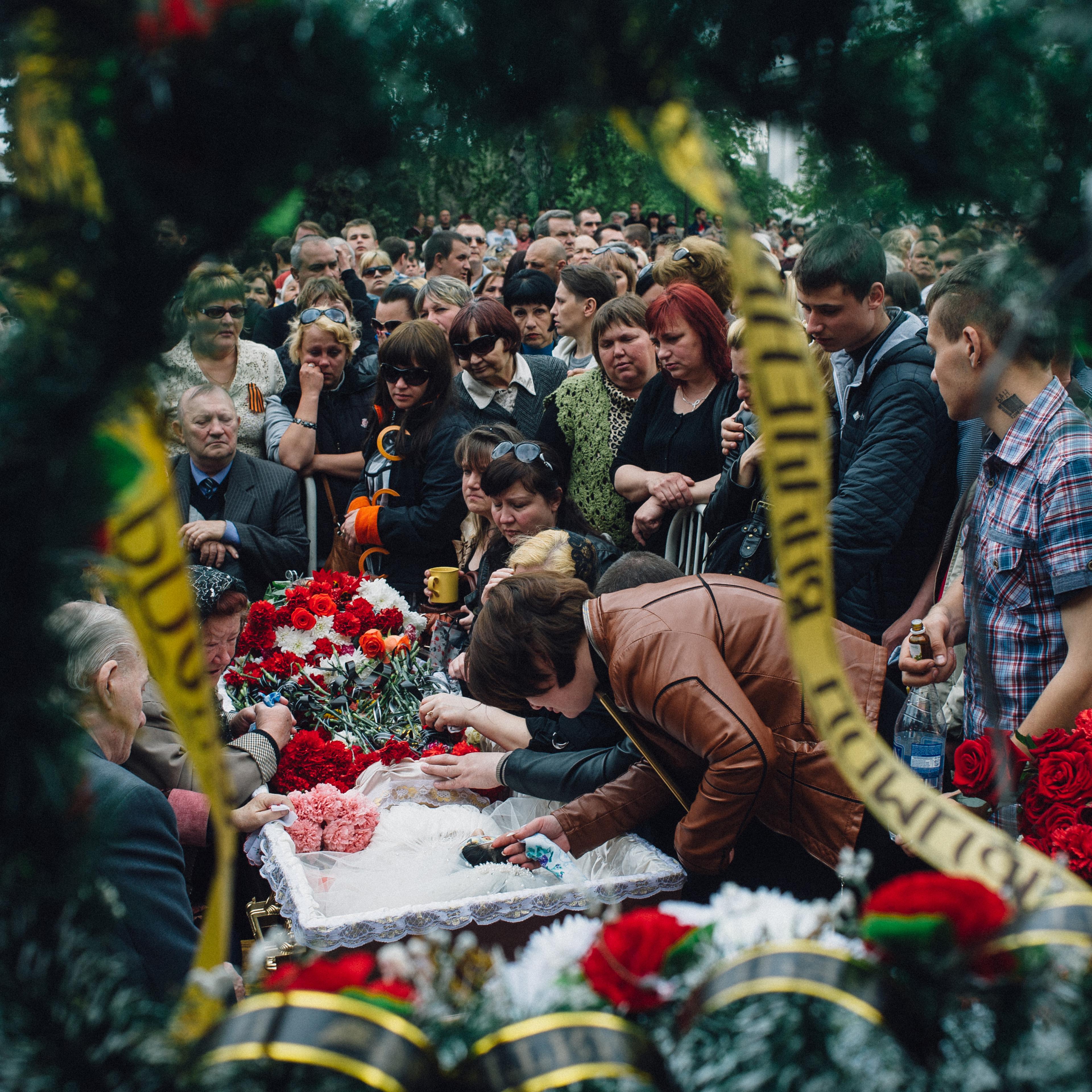 Kramatorsk, Ukraine. May 5, 2014. A funeral of a young girl age 21, Yulia Izotova in the central square in Kramatorsk. Witnesses say she was killed by shots from a Ukrainian military column on the road from Slaviansk to Kramatorsk, Kramatorsk, Maxim Dond
