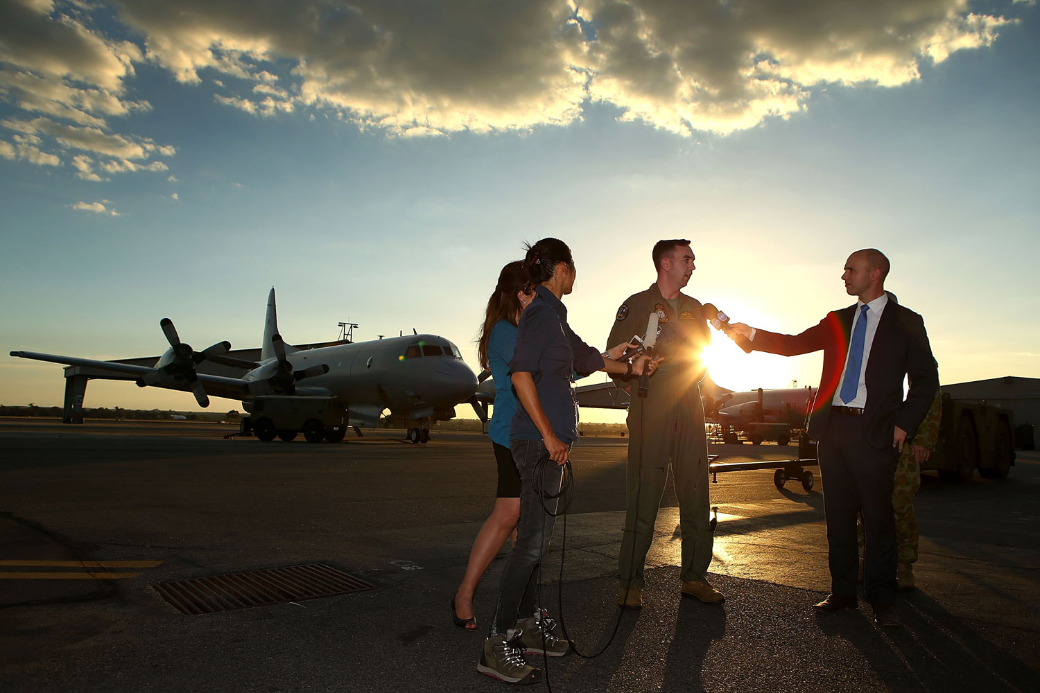 RAAF P3 Orion captain Flt Lt Benn Carroll speaks to reporters after returning from a search mission for debris from missing Malaysia Airlines flight MH370 at RAAF Base Pearce on April 8, 2014 in Perth, Australia.