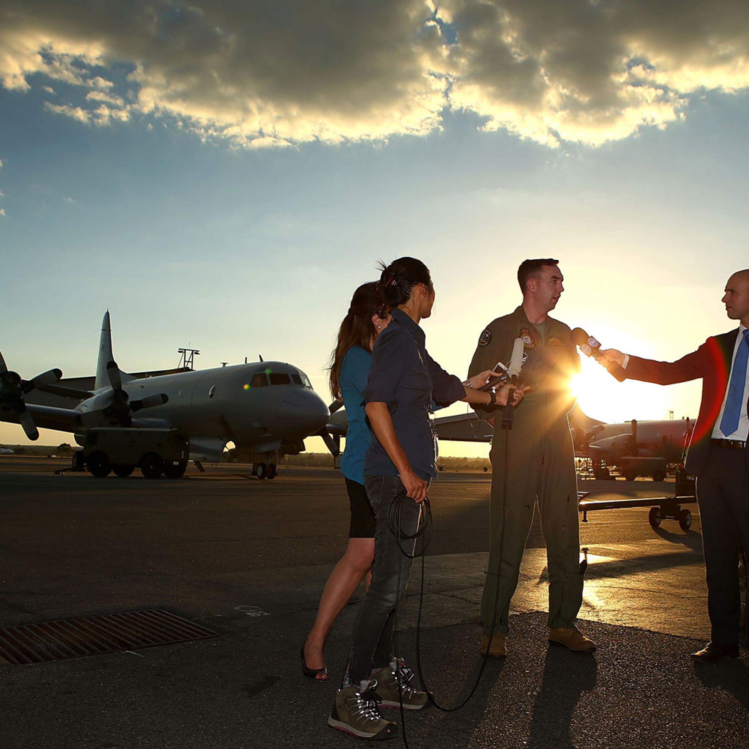 RAAF P3 Orion captain Flt Lt Benn Carroll speaks to reporters after returning from a search mission for debris from missing Malaysia Airlines flight MH370 at RAAF Base Pearce on April 8, 2014 in Perth, Australia.