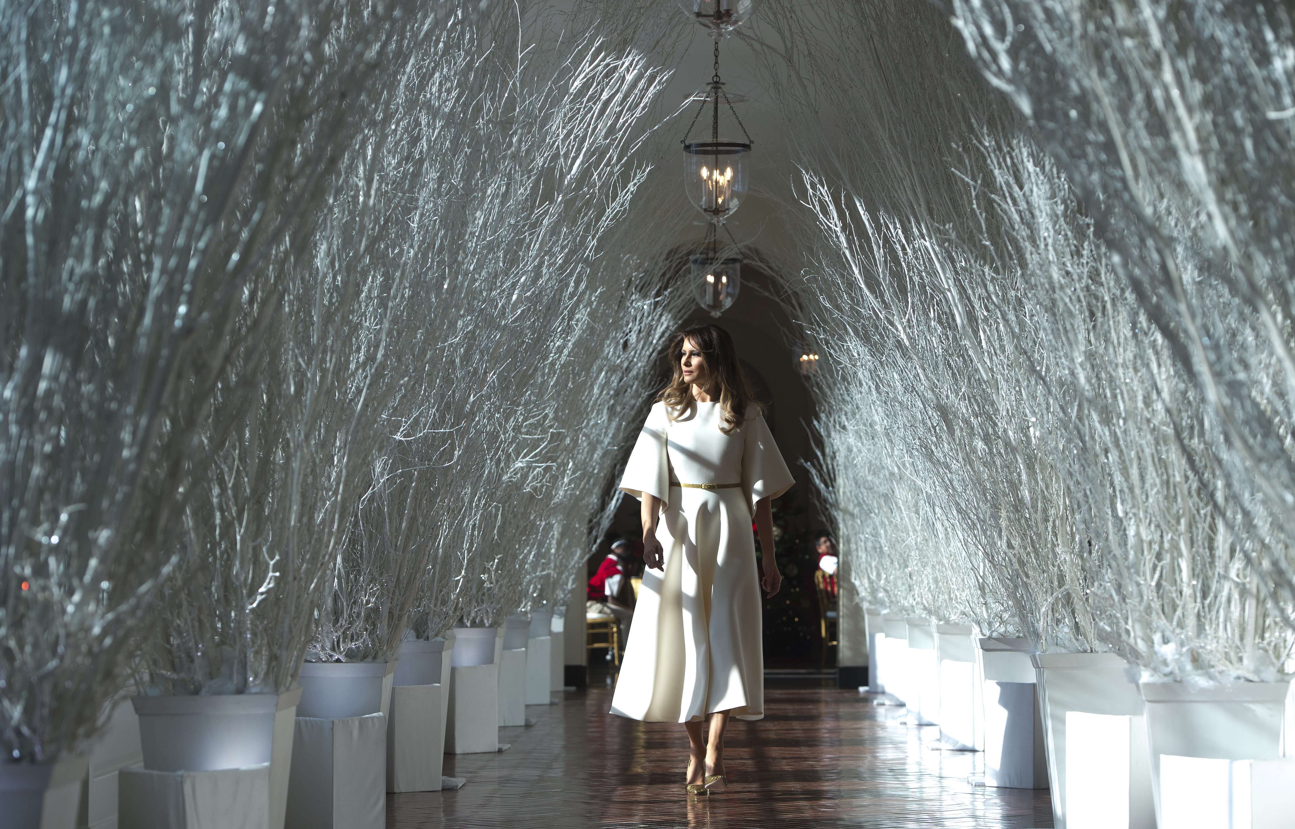 Melania Trump walks through Christmas decorations in the East Wing