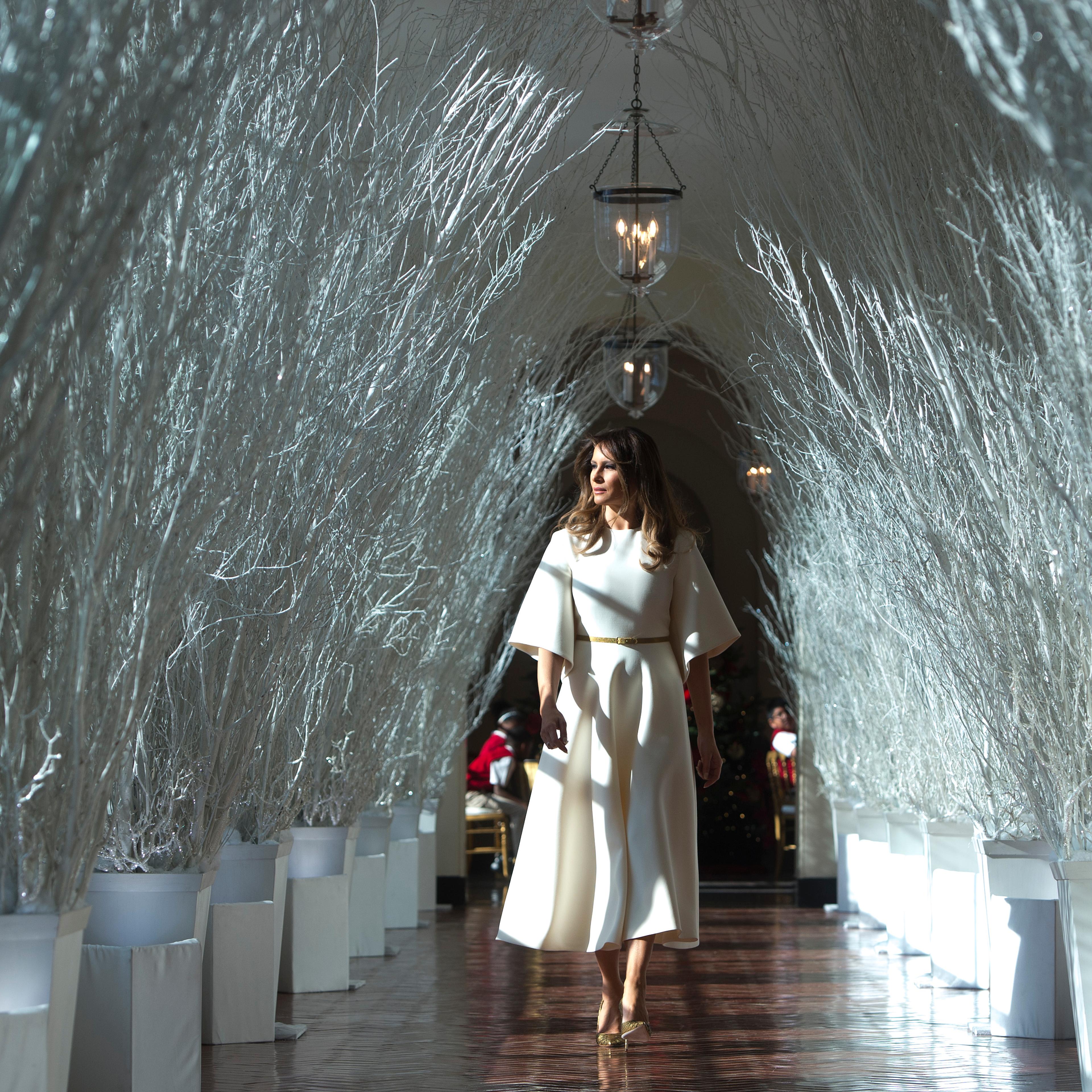 Melania Trump walks through Christmas decorations in the East Wing