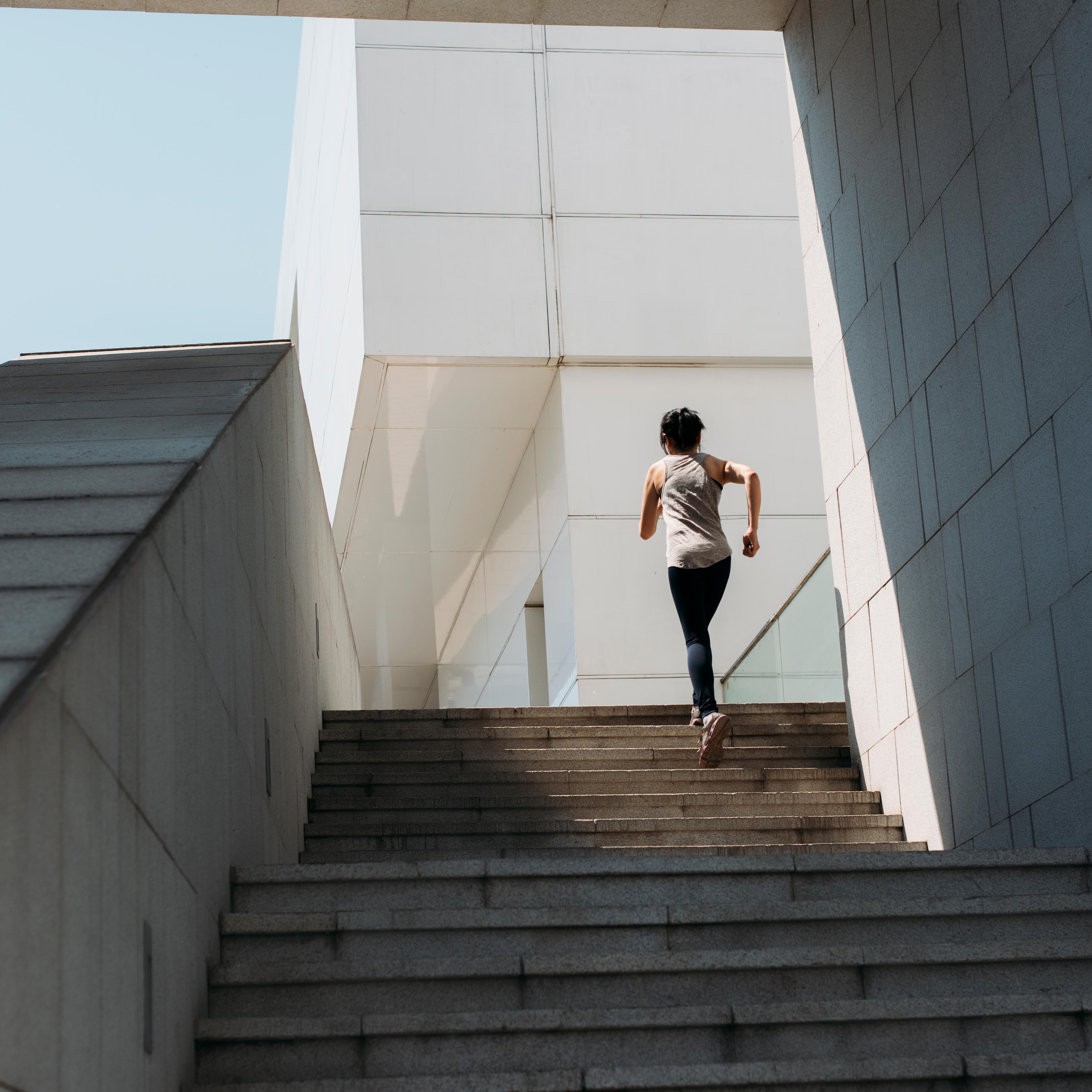 young woman running on the stairs