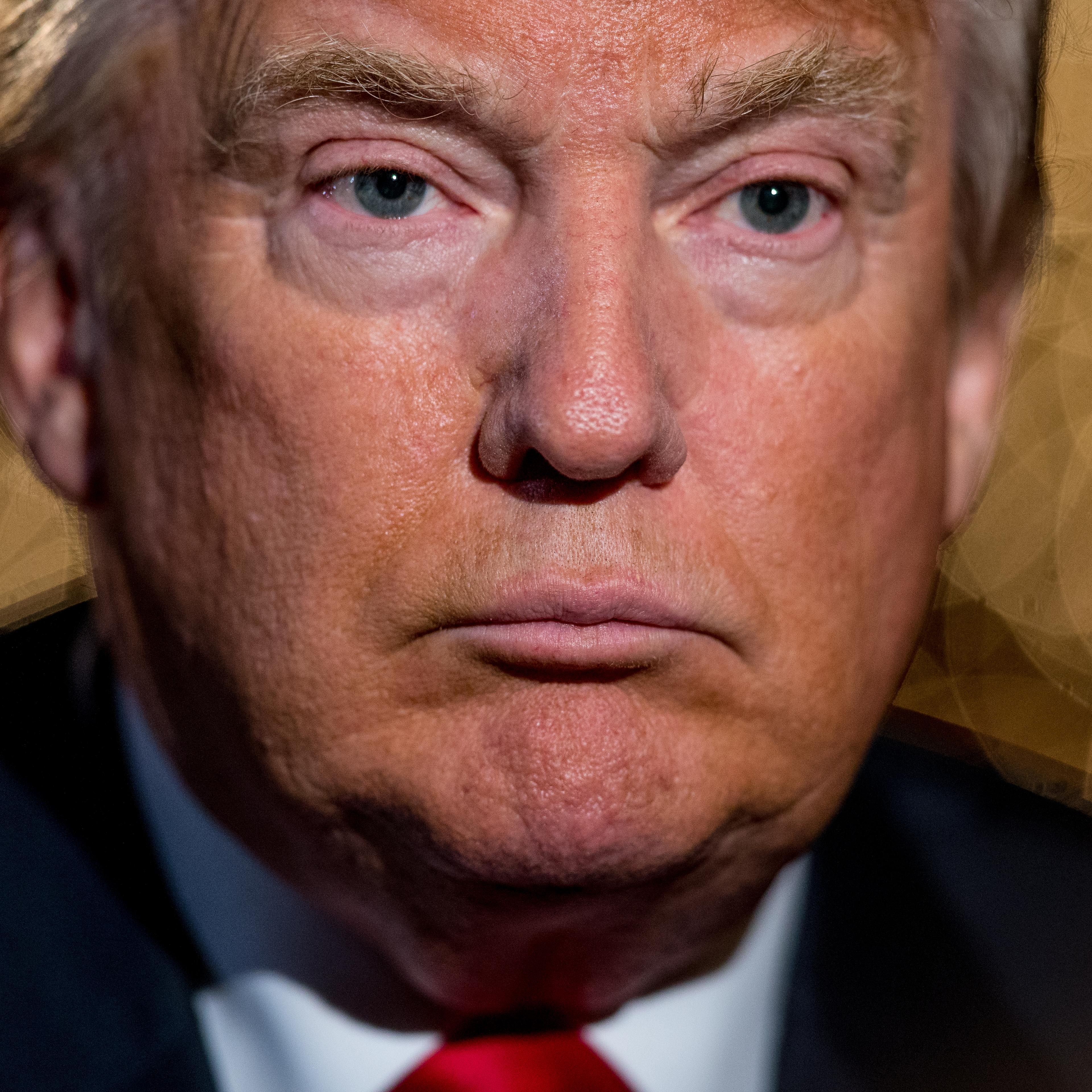 Republican presidential candidate Donald Trump pauses during an interview with the Associated Press at the Trump National Golf Club in Sterling, Va. on Dec. 2, 2015.