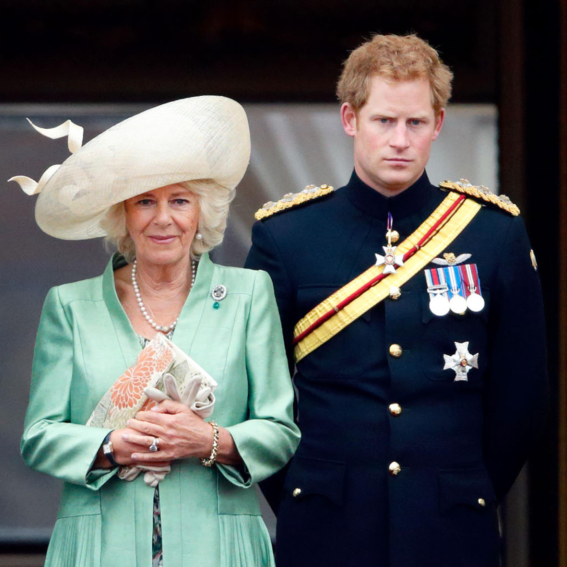 Camilla, Duchess of Cornwall and Prince Harry stand on the balcony of Buckingham Palace during Trooping the Colour on June 13, 2015 in London.