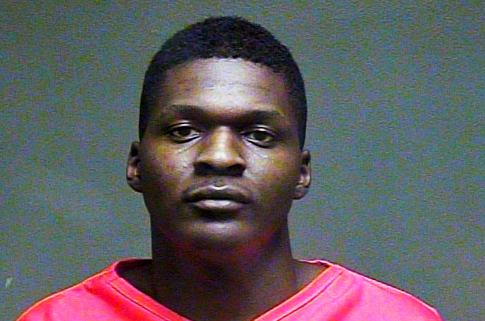 20-year-old Quinton Dashawn Laster after being arrested on Feb. 9, 2016. Police found the decapitated bodies of his grandmother, Sharon Reed, 59, and her husband, James Earl Reed, 78, in their Oklahoma City home.