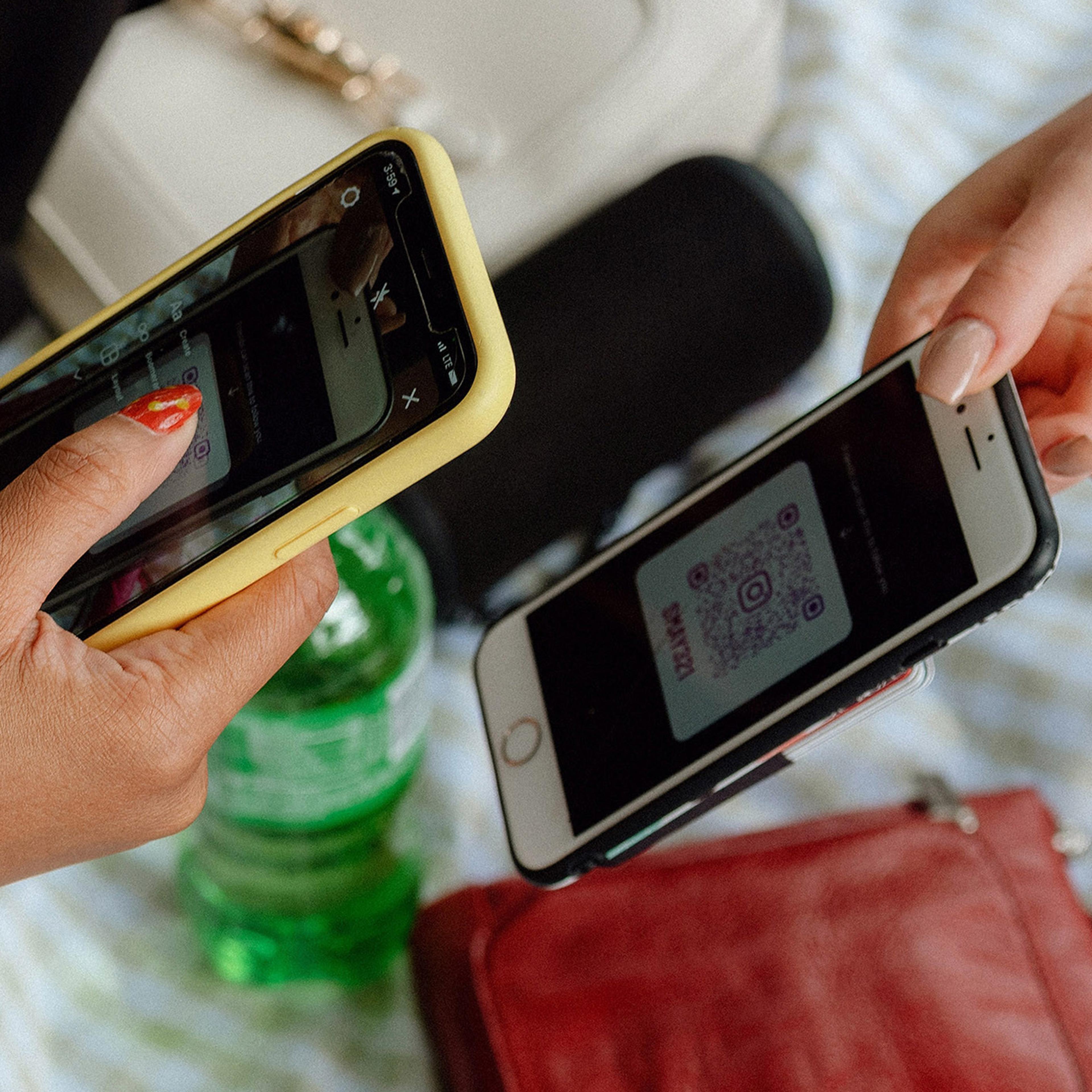 People exchange Instagram QR codes in New York on Aug. 8, 2021. The service has been eclipsed by Snapchat and TikTok among teenagers.