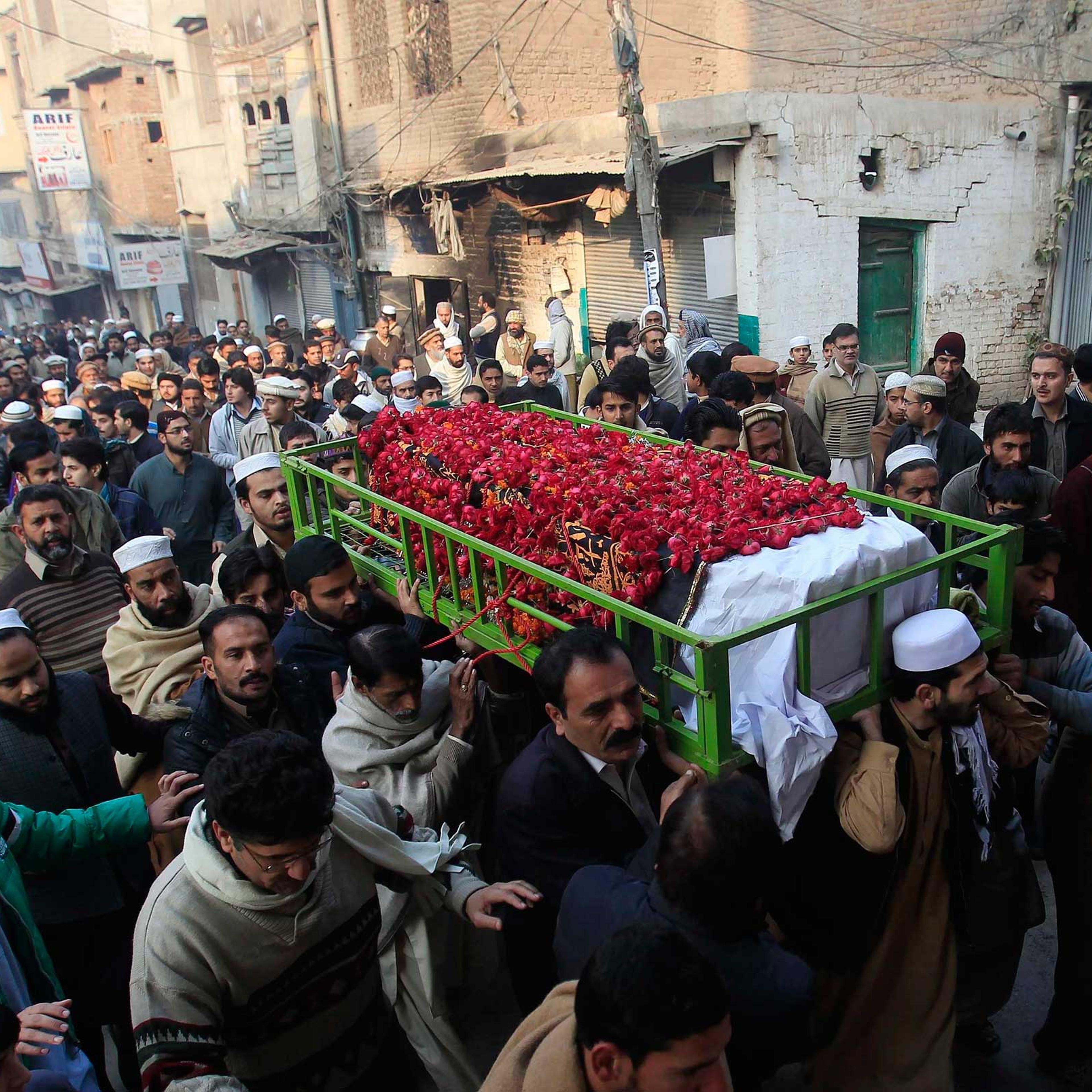 People carry the coffin of a male student who was killed in Tuesday's attack on the Army Public School, which was attacked by Taliban gunmen, during his funeral in Peshawar, Dec. 17, 2014.