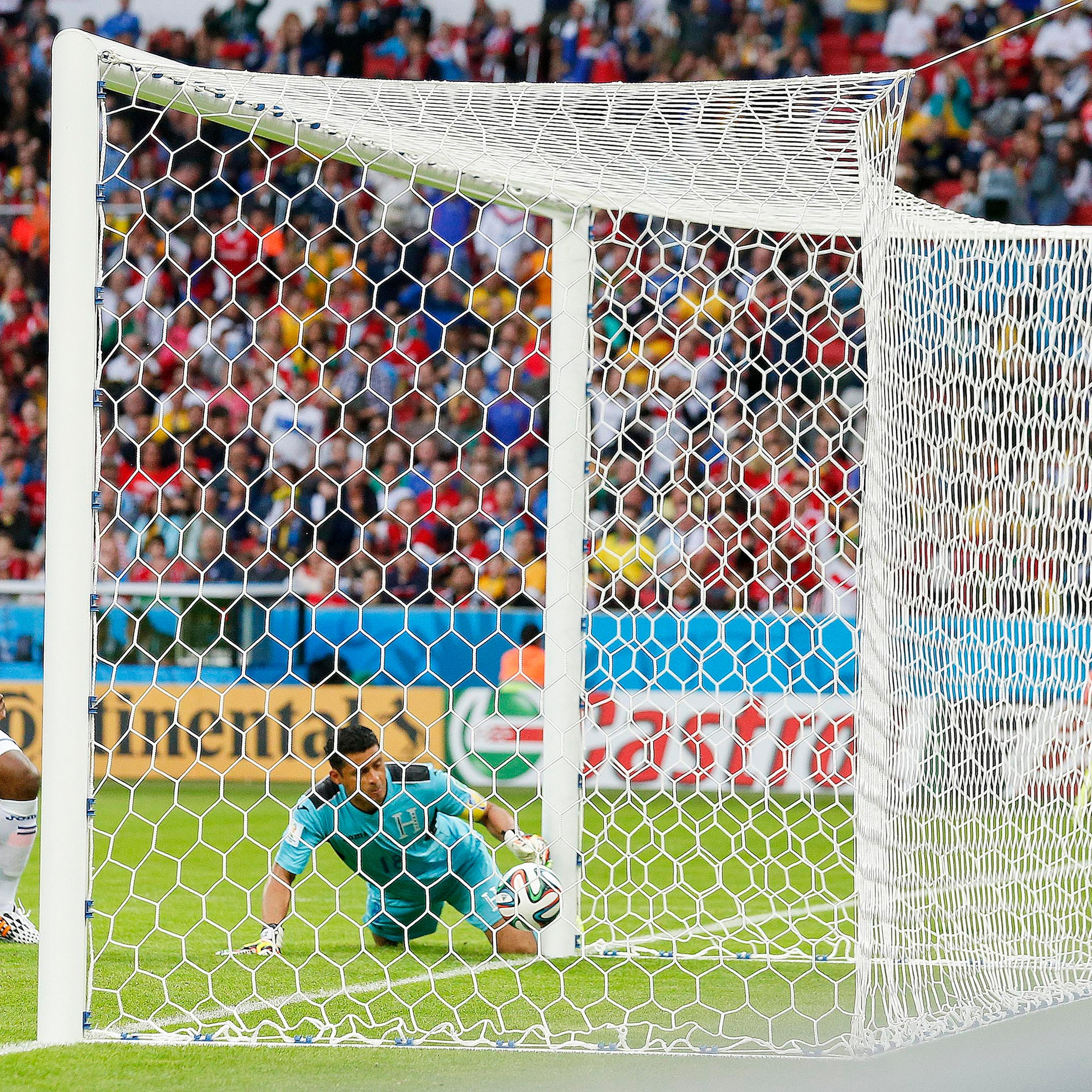 Honduras' goalkeeper Noel Valladares bundles a shot from France's Karim Benzema, far right, into his net for an own goal during the group E World Cup soccer match between France and Honduras at the Estadio Beira-Rio in Porto Alegre, Brazil on June 15, 20
