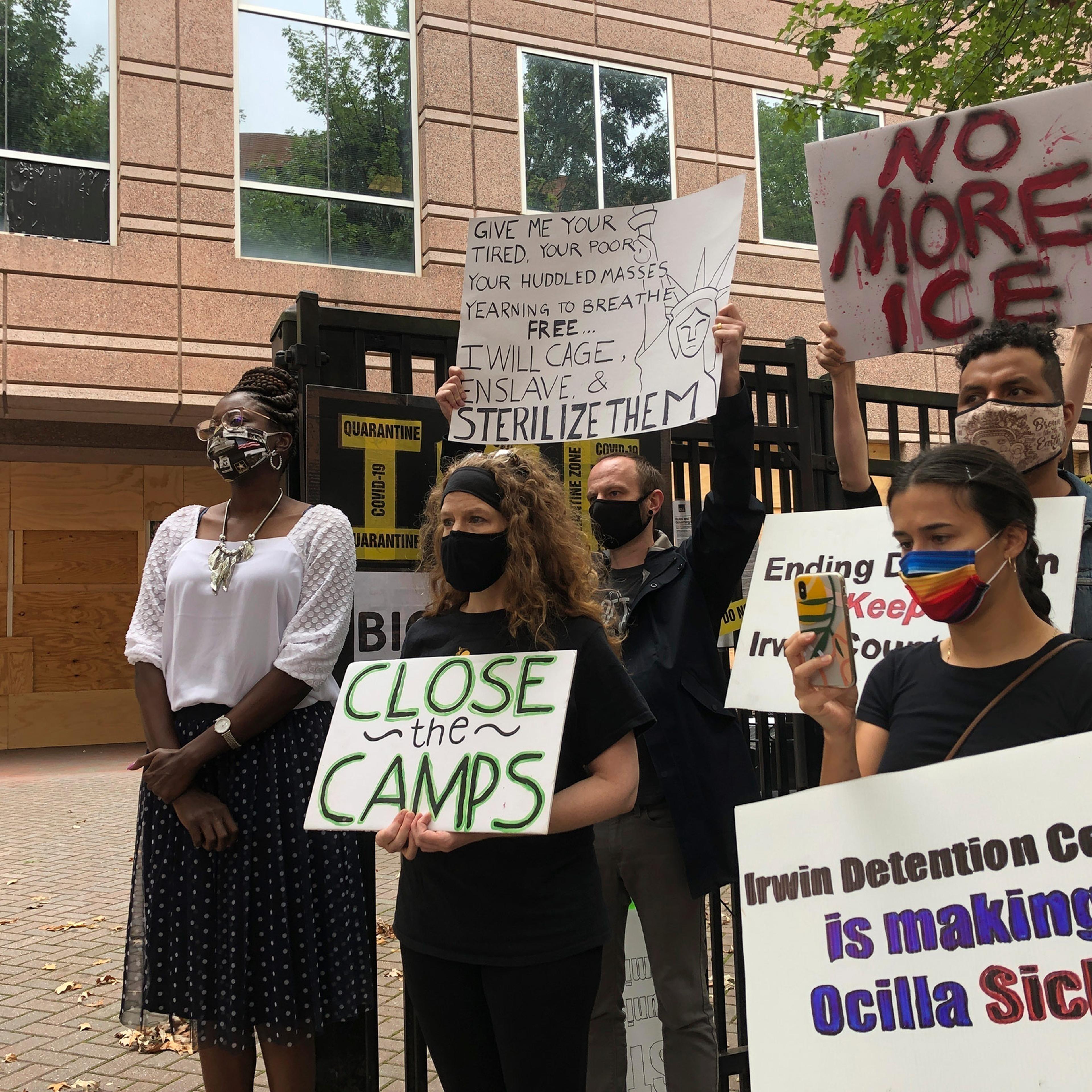 Dawn Wooten, left, a nurse at Irwin County Detention Center in Ocilla, Ga., speaks at a news conference in Atlanta protesting conditions at the immigration jail, on Sept. 15.