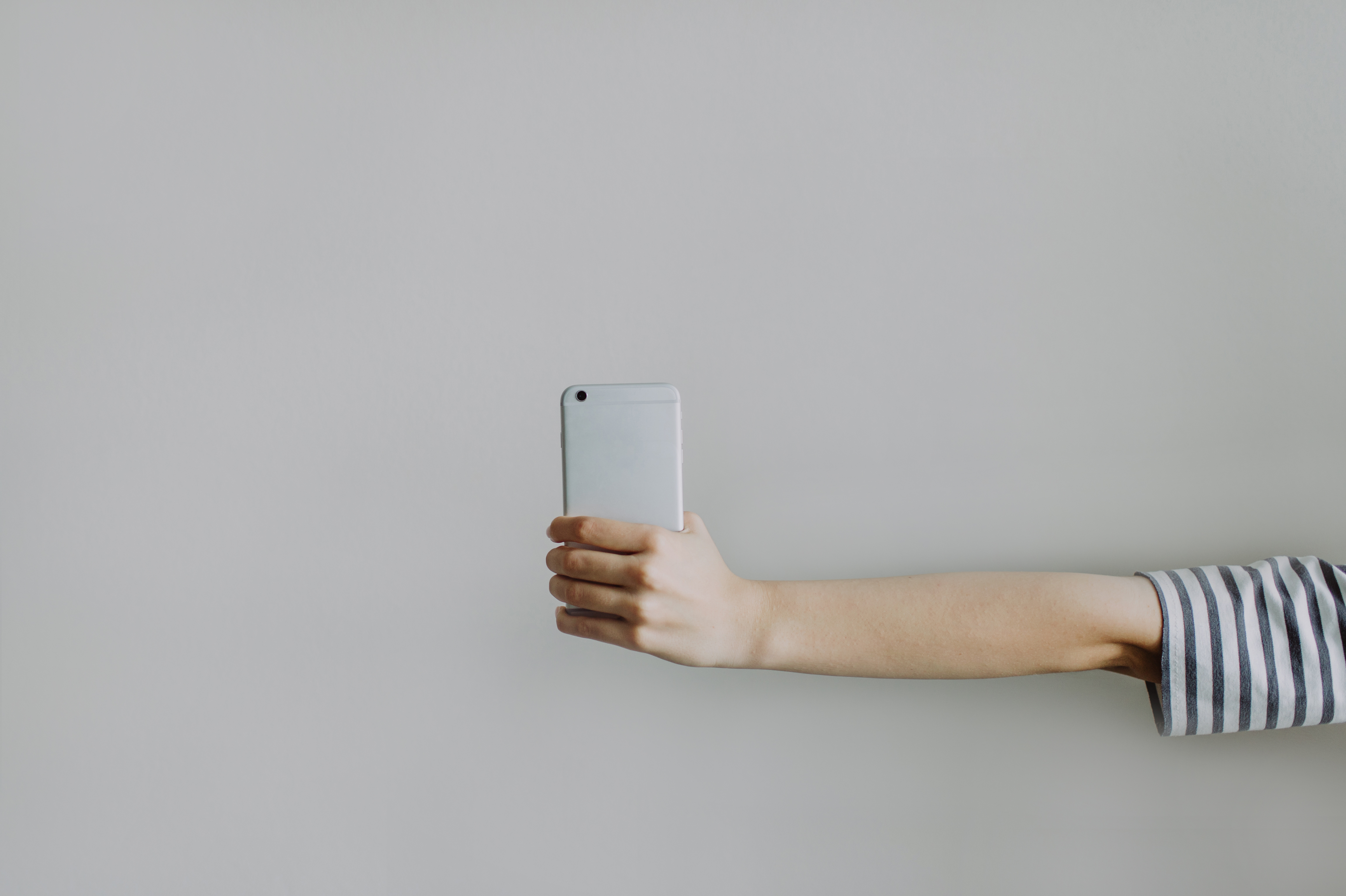 Woman's hand holding a mobile phone