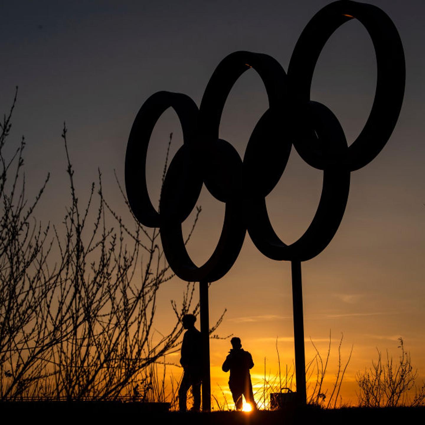 The Olympic rings are seen as sunset in the Olympic Park in Stratford