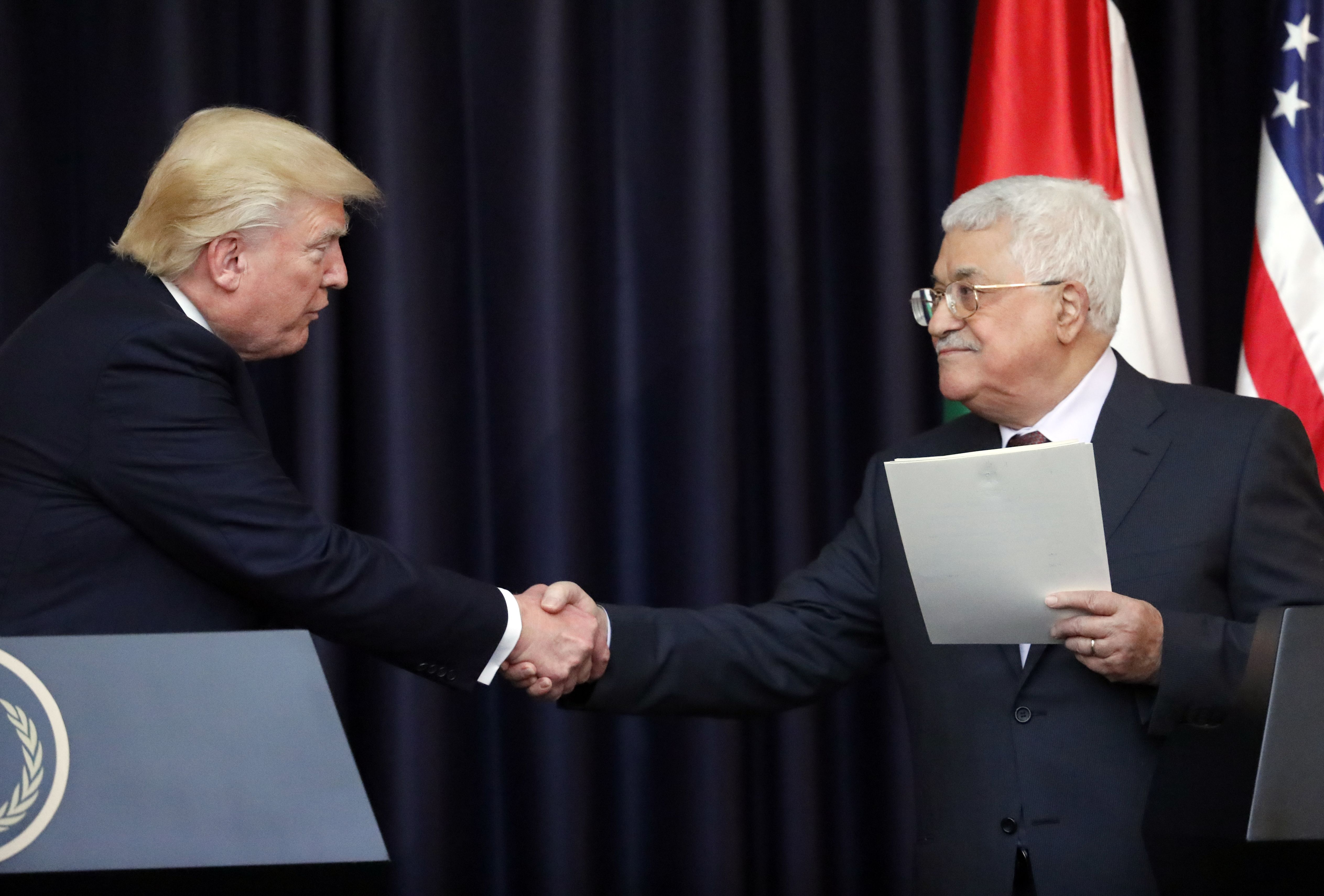 US President Donald Trump (L) and Palestinian leader Mahmud Abbas give a joint press conference at the presidential palace in the West Bank city of Bethlehem on May 23, 2017.