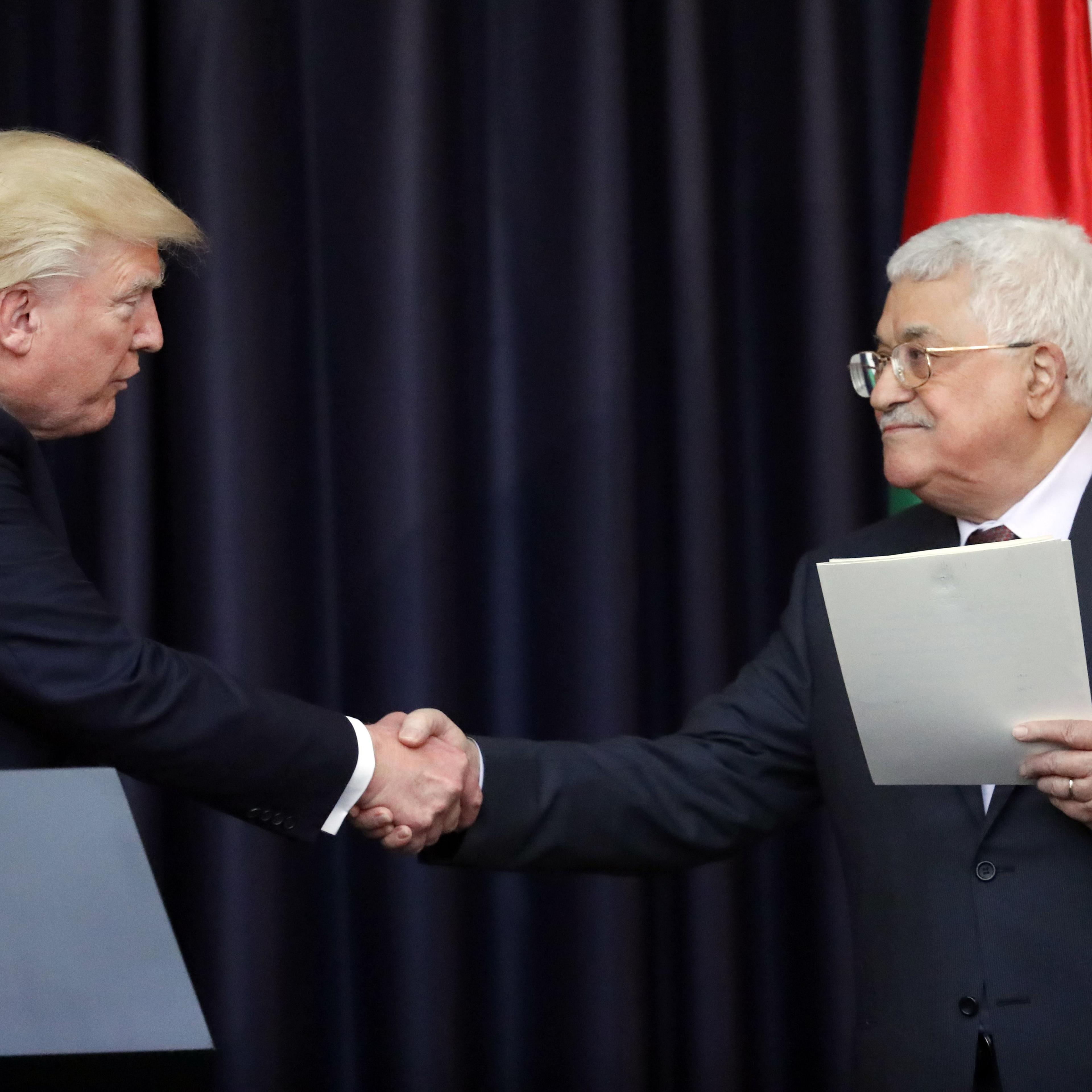 US President Donald Trump (L) and Palestinian leader Mahmud Abbas give a joint press conference at the presidential palace in the West Bank city of Bethlehem on May 23, 2017.