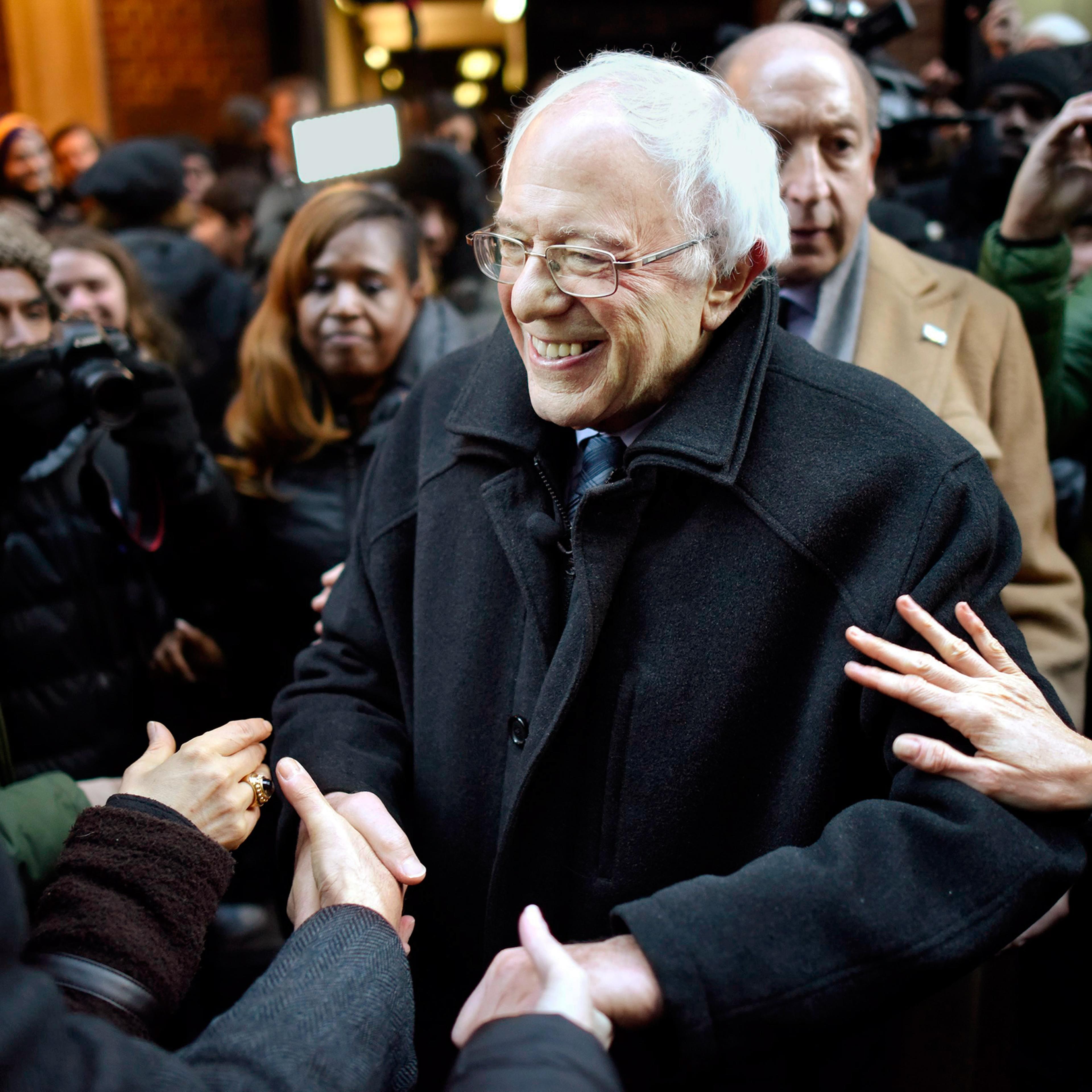 United States Democratic presidential candidate Senator Bernie Sanders (C), of Vermont, shakes hands with supporters following a speech about Wall Street and his plans for new financial regulations at Town Hall in New York, New York, USA, 05 January 2016