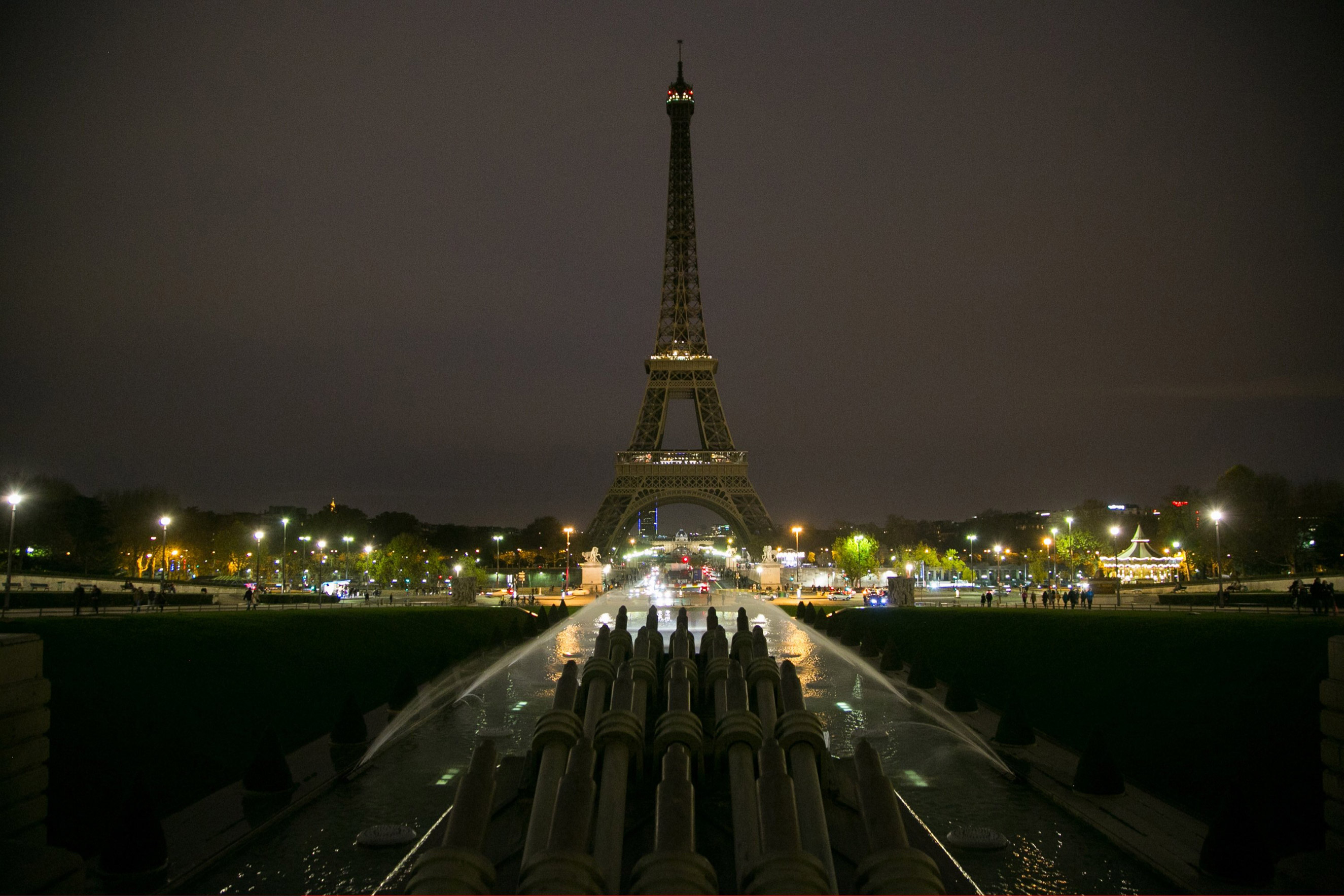 The Eiffel Tower turns off its lights in memory of the more than 120 victims the day after the terrorist attack on Nov. 14, 2015 in Paris.