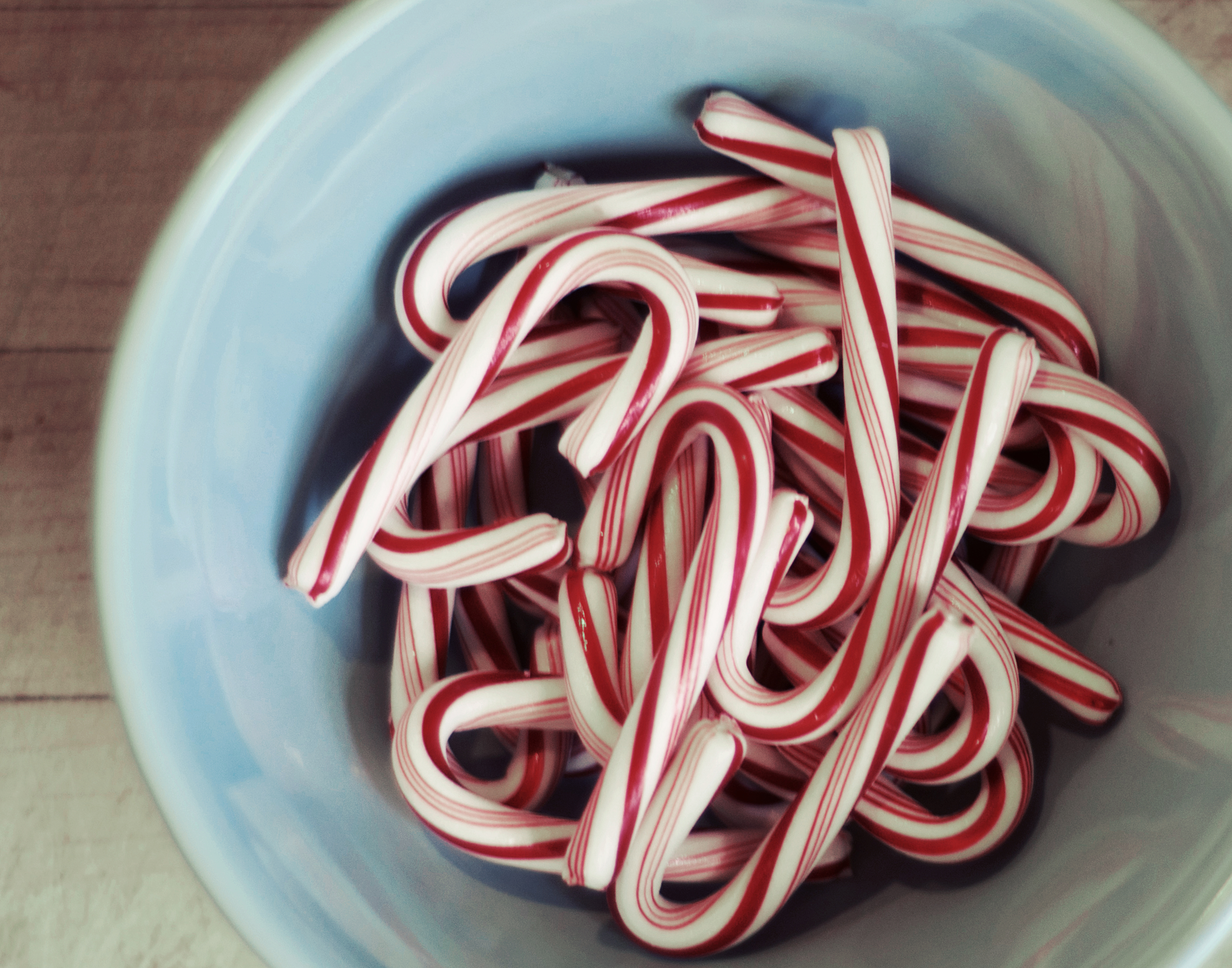 Candy canes in blue bowl
