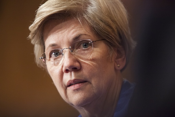 Senator Elizabeth Warren listens to Janet Yellen's testimony during a Senate Banking, Housing, and Urban Affairs Committee during a hearing on The Semiannual Monetary Policy Report to the Congress.