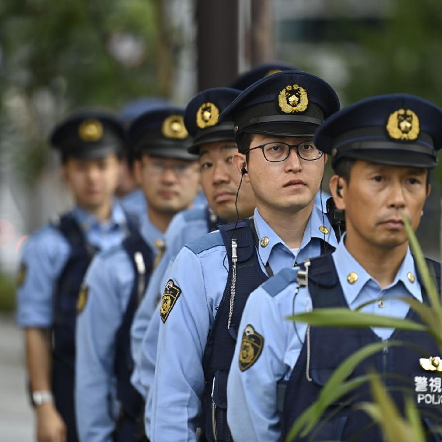 Police officers stand guard as hundreds of protestors gather to protest against Israeli airstrikes in Gaza Strip, near Israel embassy in Tokyo, Japan on Oct.21, 2023.