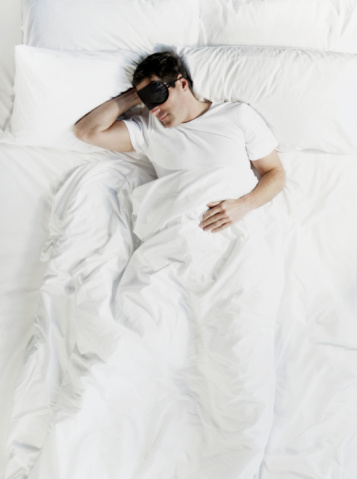 man-sleeping-bed