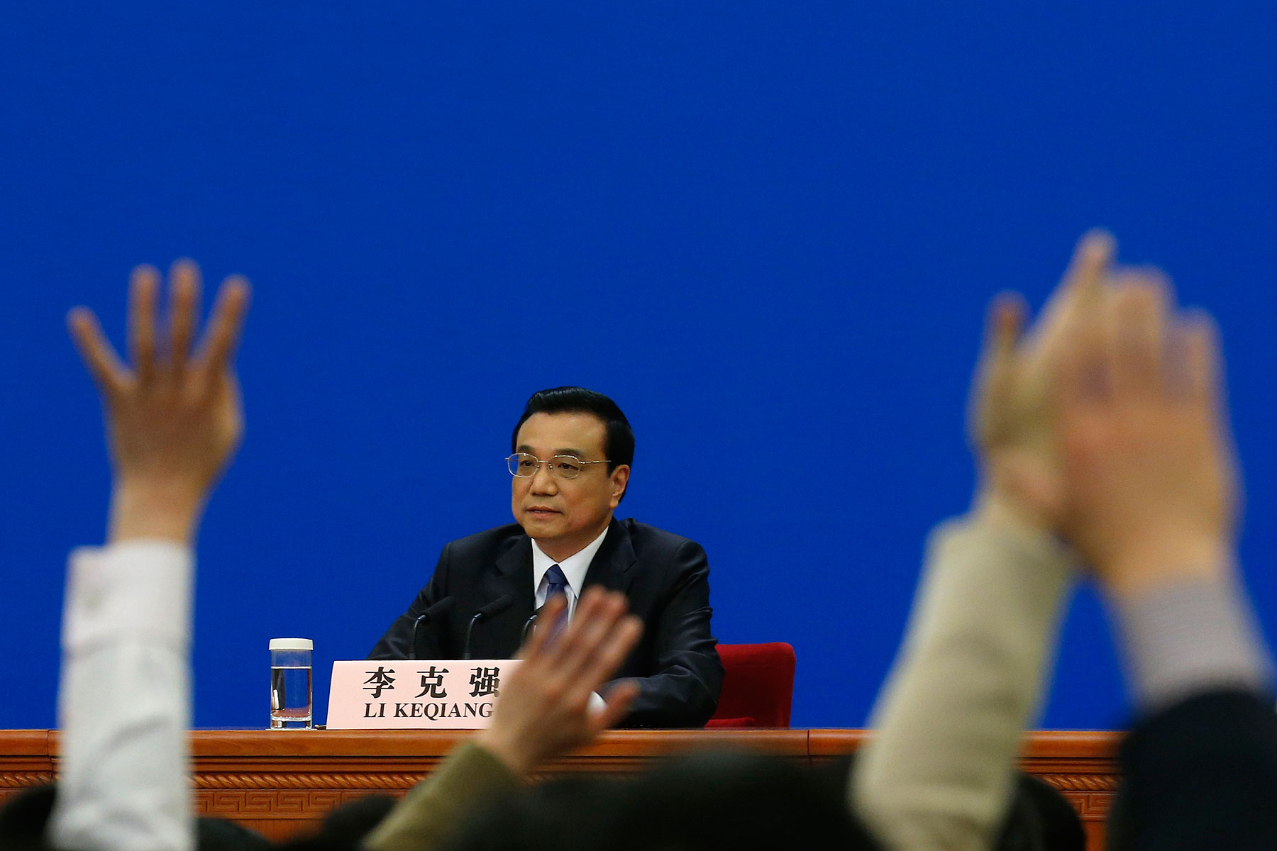 China's Premier Li Keqiang takes questions during a news conference, after the closing ceremony of the Chinese National People's Congress (NPC) at the Great Hall of the People, in Beijing March 13, 2014
