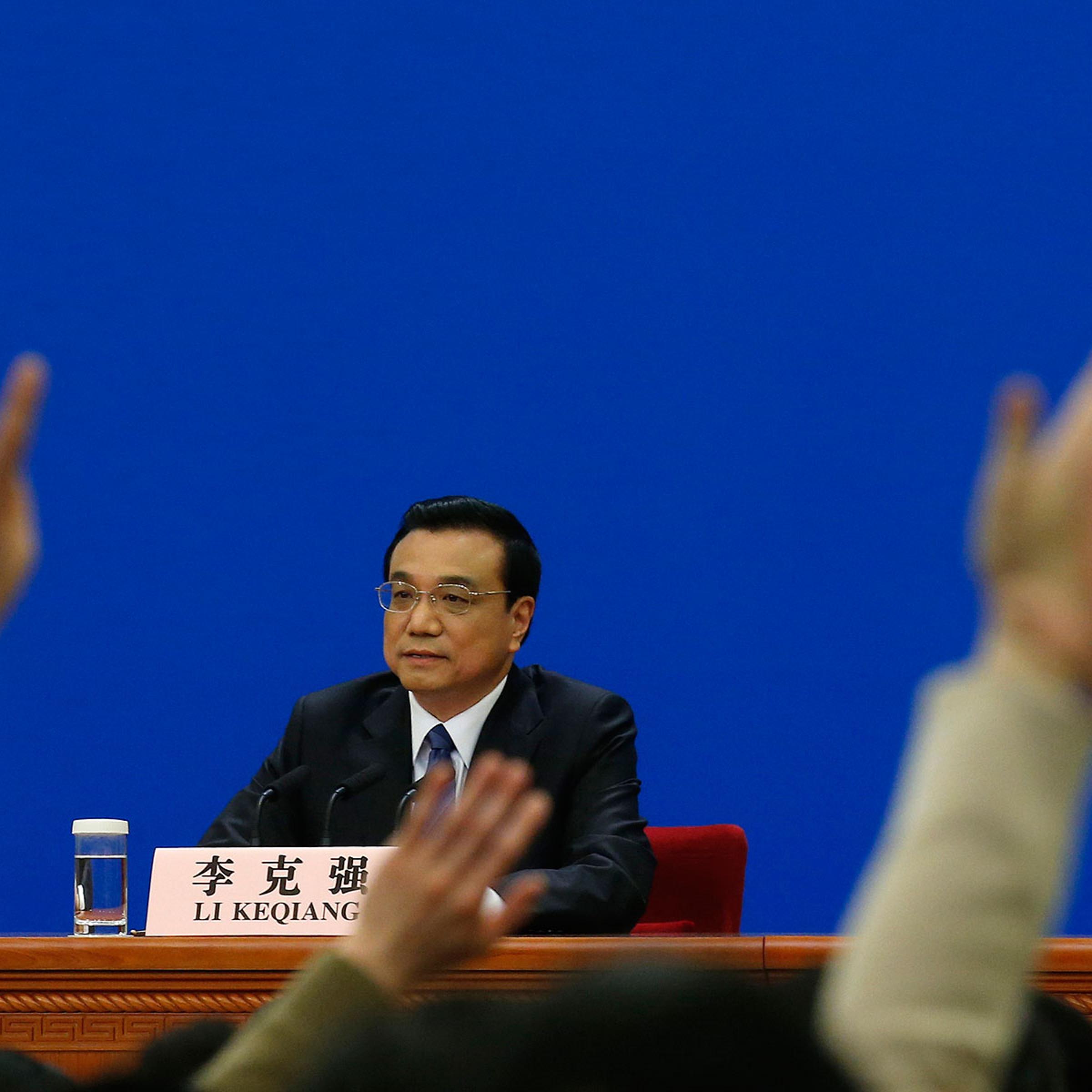 China's Premier Li Keqiang takes questions during a news conference, after the closing ceremony of the Chinese National People's Congress (NPC) at the Great Hall of the People, in Beijing March 13, 2014