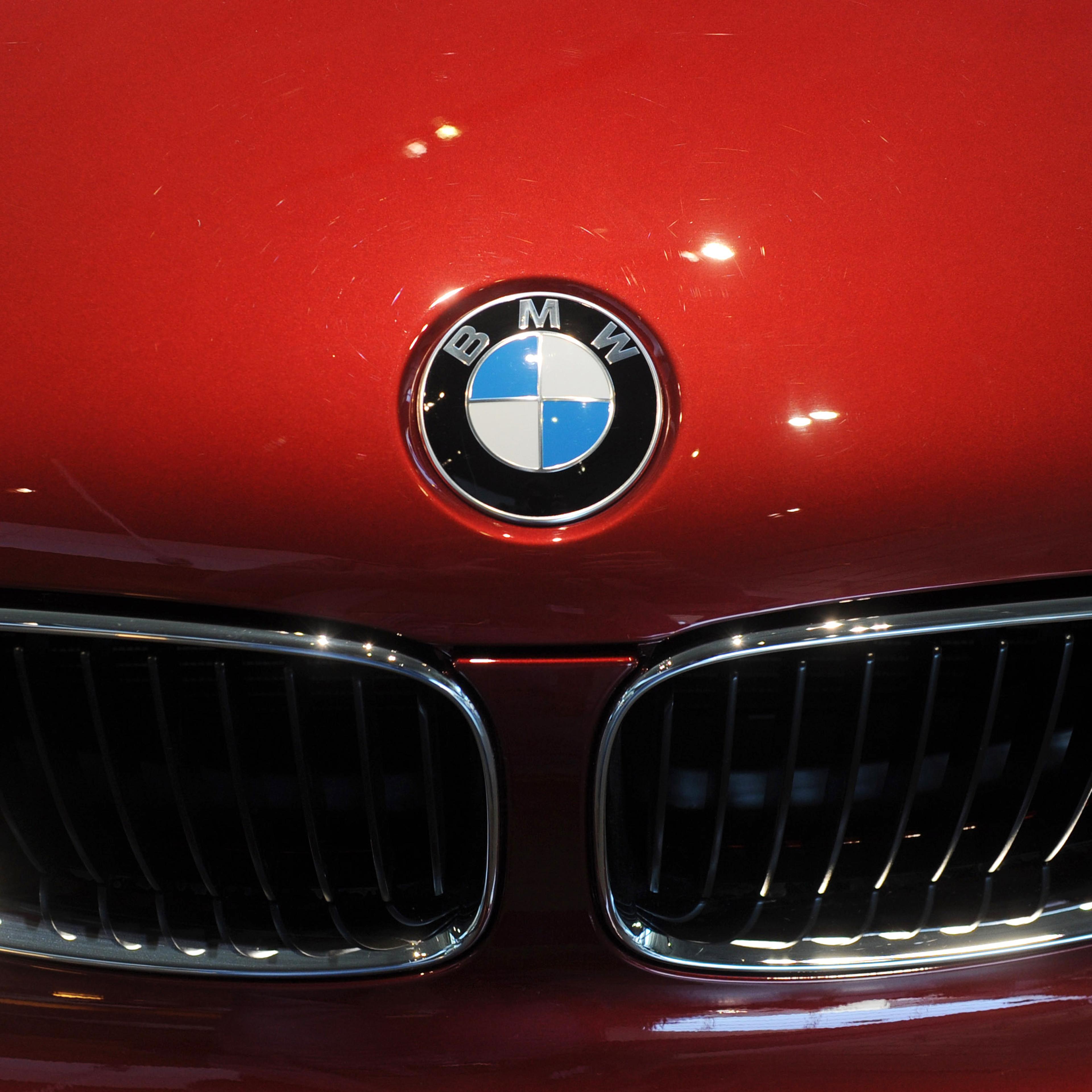The logo of German luxury car maker BMW can be seen on a BMW car in Munich, Germany, on March 15, 2011.