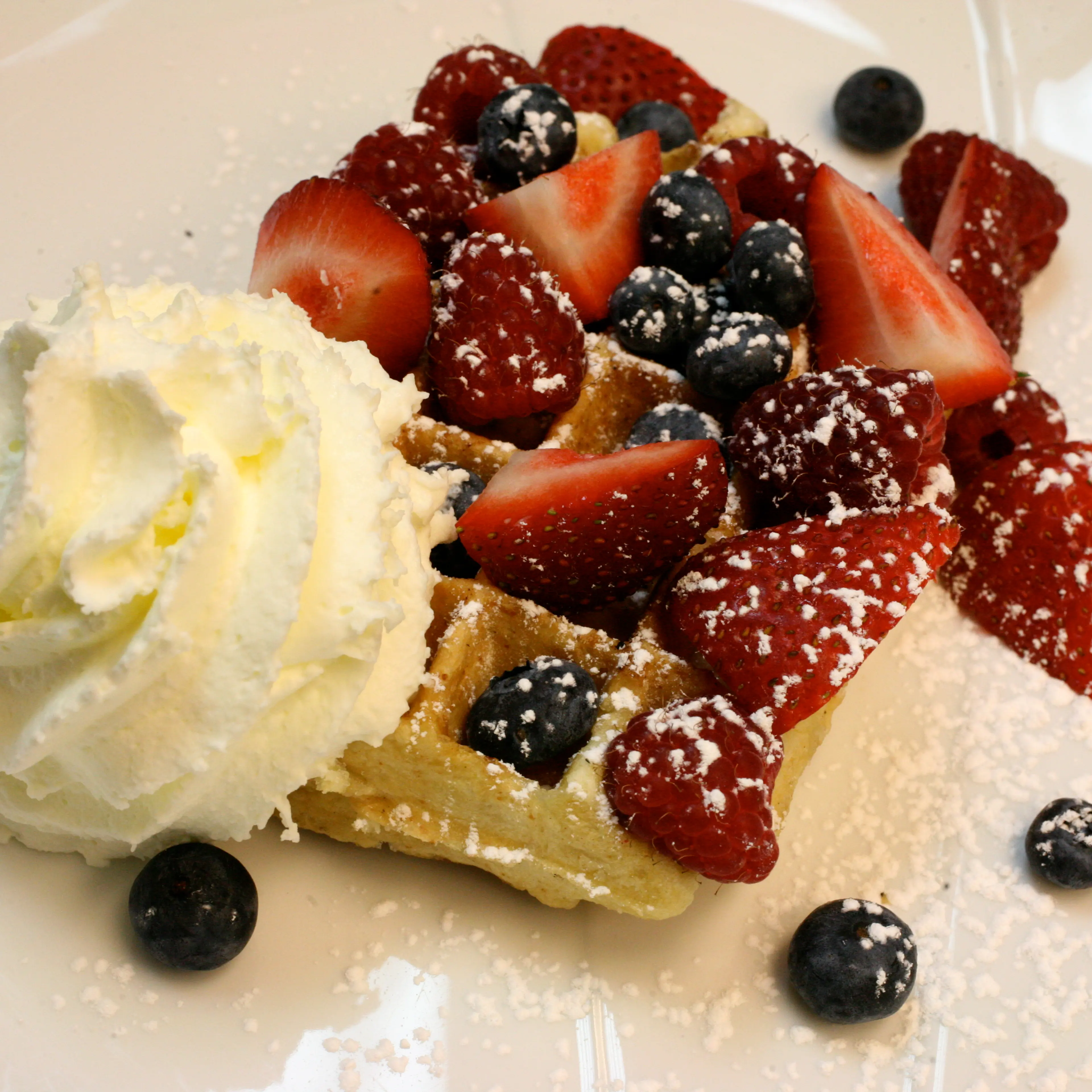 Liege waffle with fresh berries and whipped cream at Locolat in Washington, DC.