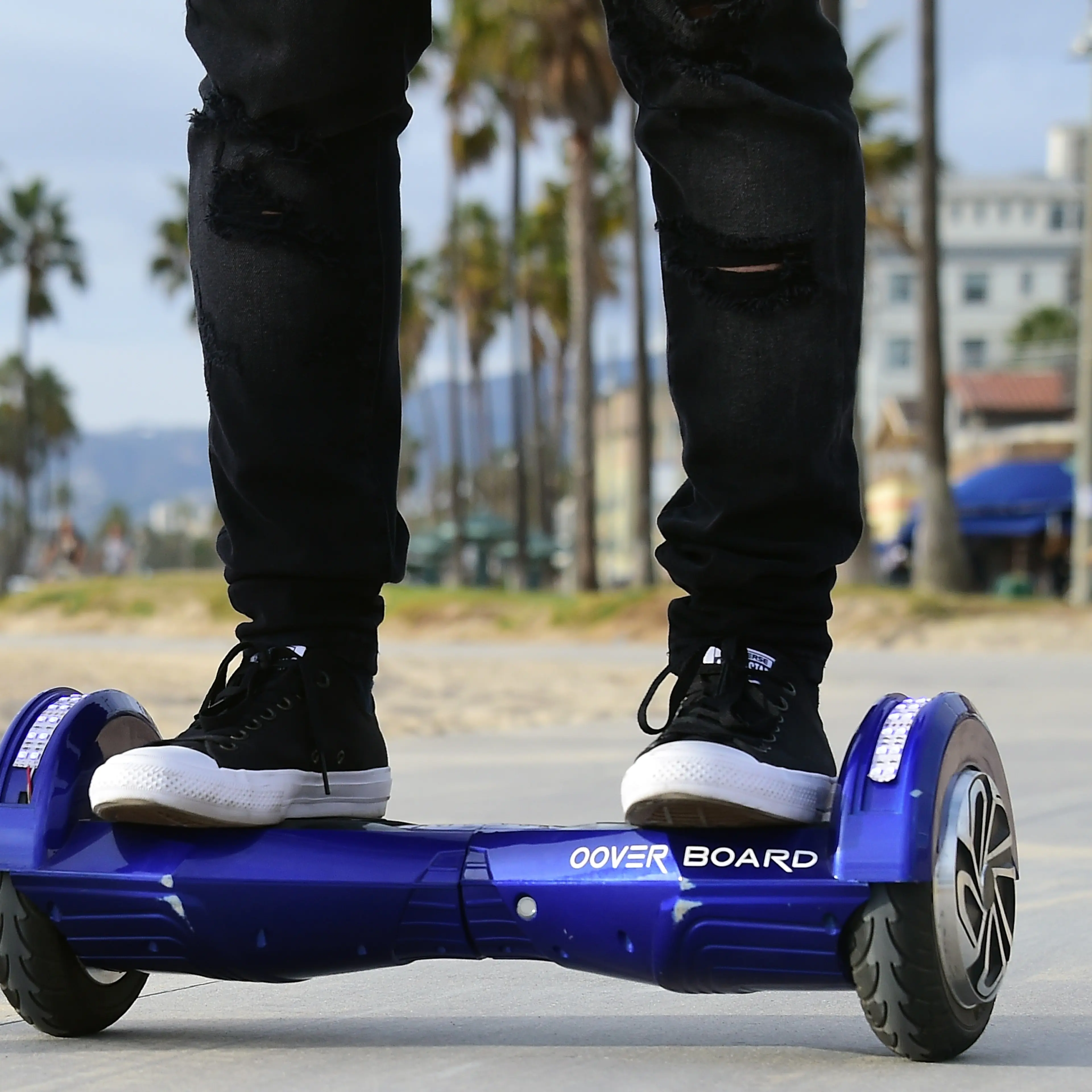 Michael Tran uses his hoverboard on the Venice Beach Boardwalk on December 10, 2015.